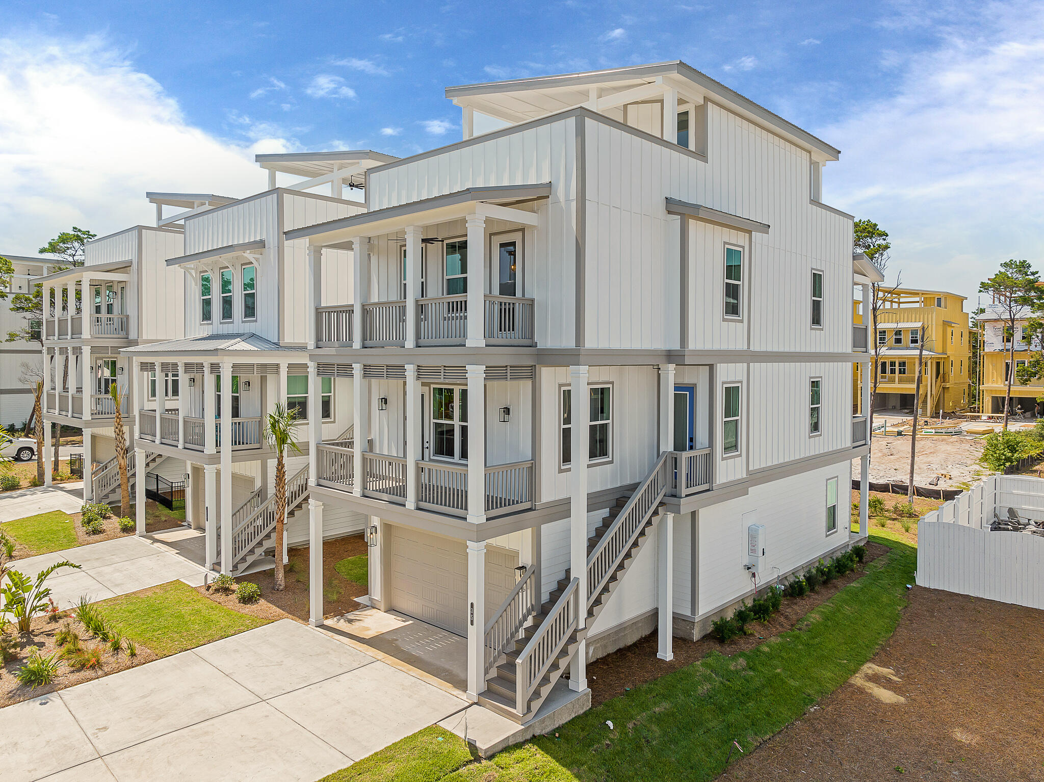 Sharply reduced and the lowest four bedroom offering positioned to sell. A Brock built home with a contemporary flair. There are three beach accesses less than one mile from the community. Primed for a short-term, rental, secondary, or primary; projections are $140,000. The three story linear beach home features a downstairs ensuite space that could accommodate a bunk room and flows into a flex space with built-in seat bench. Conveniently leading to the ground level oversized garage with room for two cars and a golf cart or gym with shower.  As you ascend the stairs you are greeted by sleek finishes with touches of white and black. The floor plan flows with a built-in office nook, dining area, center island white quartzite, and an additional gathering space with a dynamic black statement wall featuring a linear gas fireplace on the second level. There are balconies on either side of the open-concept second level providing multiple outdoor spaces. 
Additional balconies flank the third floor and a spacious owner's suite offers its own private balcony and oversized glass shower with large bench adorned in modern soft white waves with black pebble accents. There are two additional bedrooms and ensuite baths on the third floor. A closet laundry is conveniently placed with decorative tile in a star pattern.
The piece de resistance is the roof top outdoor space offering 2000 square feet with shimmering Gulf views. This terrace allows for a hot tub and is pre-wired offering one of the most enticing gathering spaces. Envision night lights with soft music and entertaining under the stars. To finish the evening take a stroll to the community pool and take a dip.
Twin Palms is positioned minutes from the underpass crossing to the East end of 30A and 30Avenue an outdoor lifestyle center offering boutique shopping and dining. For the outdoor enthusiast you are a short distance to the sandy beaches along the emerald green waters of the Gulf of Mexico. 
In addition check the water sports on Lake Powell unparalleled offering one of the the largest coastal dune lakes in North America covering almost 800 acres. The lake is a known for one of the areas best kept secrets for kayaking, paddle boarding, bird watching, hiking, and both freshwater and saltwater fishing.