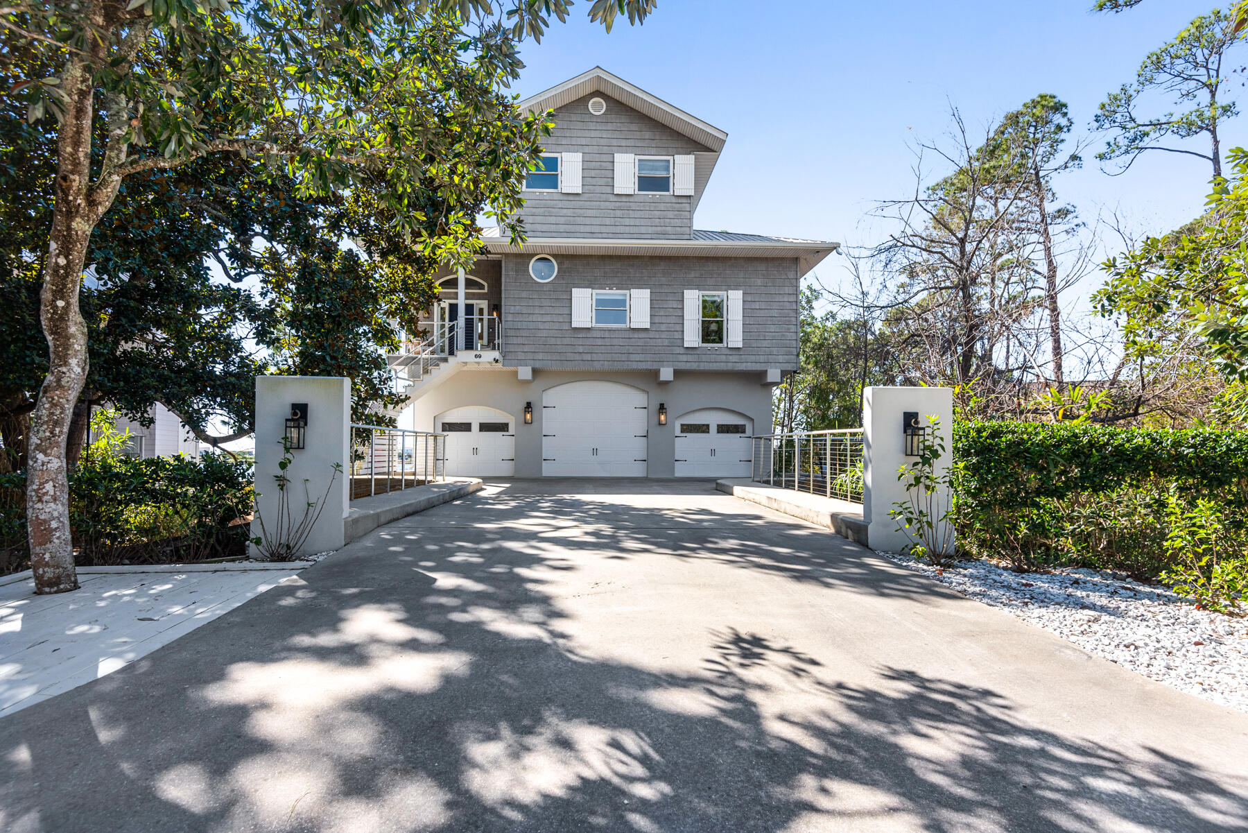 Coastal Elegance on Oyster Lake one block from 30A and the Gulf of Mexico! Rare opportunity to own a lakefront home in South Walton. This coastal retreat boasts a private dock, elevator, oversized garage (perfect for a boat), well equipped gourmet kitchen, lock out unit on the ground floor for rental opportunity and beautiful outdoor living spaces. Golf cart conveys as well. Stunning lake views from the 2nd floor main living area. 3rd floor master has breathtaking views of the gulf from the private balcony. White planked walls, natural light, soaring ceilings and architectural interest throughout make this a stand out! Situated on a third of an acre it offers privacy as well. Experience 30A life at its best!