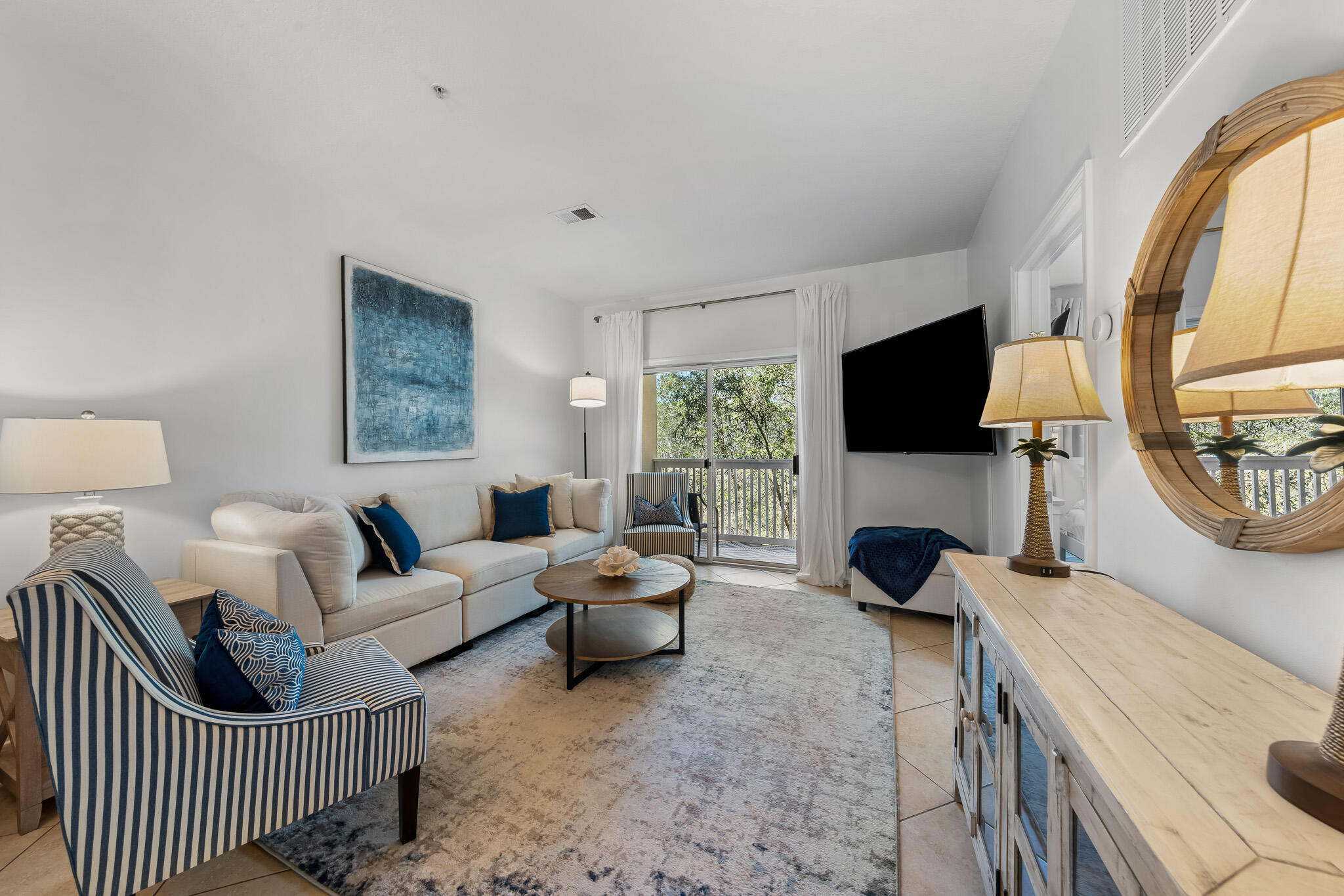 UNDER AN ACTIVE LISTING AGREEMENT

Corner Unit, Adjacent State Park, w/ Elevator Access! Prime 30A Location in the heart of Seagrove Beach.

Located within a mile of the sands of Seagrove Beach you will find Herons Watch 7205. Whether you enjoy relaxing with outdoor activities, convenient access to coffee and dining opportunities, or the ability to enjoy the sounds of nature from your back porch, this fully furnished Heron's Watch condo provides it all.


For outdoor enthusiasts, there is a nature trail and bike path running through the Point Washington State Forest right outside your back door, kayak storage adjacent to your building and a community dock granting easy access to Eastern Lake. Simply YOLO your way through sunny days by grabbing your kayak or paddle board and paddling down to the Gulf, or hop on your electric bike and cruise your way through the pristine natural oasis of the State Forest.

If you prefer to dine and socialize in your down time, Beachy Bean coffee and Old Florida Fish House are located just outside the complex and both offer abundant outdoor seating, views of Eastern Lake and entertainment opportunities whether is just you or a group of friends getting together.

Stepping inside the condo you'll find a modern and coastal, professionally designed condo. With new furniture, ample natural light, and a well utilized 940 sq ft floorplan, this two bedroom two bathroom condo is an ideal place to retreat after living the 30A lifestyle for full-time residents, second homeowners, and renters alike. The spacious kitchen features wood cabinets, a suite of stainless steel appliances and ample prep space on the durable granite counters.

The open entertainment space offers a bar height breakfast counter, a transitional dining space and a roomy living area that overlooks the state park right out your back door. Enjoy coffee from your back porch to the sounds of the birds and the chance to view wildlife such as deer, rabbits and other area locals.

The primary suite overlooks the state forest from both of its windows, and offers a plush king bed and seating chair to help you unwind and relax after full days in the sun. The en-suite bathroom offers a tub shower combo.

The guest room is located near the front of the condo and is outfitted with a queen bed and twin sized trundle, helping to maximize space for guests as needed. The second bathroom is located adjacent to the living room and next to the laundry room and pantry combo.

Heron's Watch Condominiums come complete with a gated entry, golf cart charging stations and a community pool. It offers the rare blend of entry level affordability to 30A and convenience to the best of the 30A lifestyle while being centrally located in Seagrove Beach.