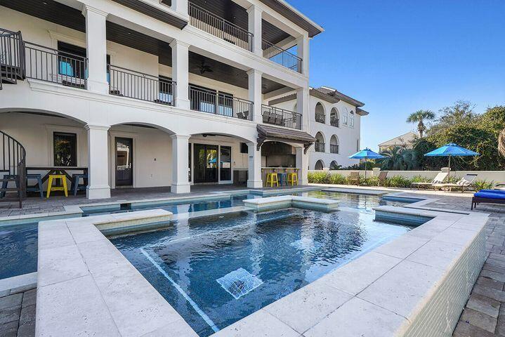Welcome to ''SUNREAL'', an Investors dream! Located in the Gulf-Side gated community of Destiny West. providing a vacation paradise, offering privacy to owners and guests.

This rental machine already has over $415K booked already for 2022.

Guests also enjoy tennis courts, and a Clubhouse.

5,491 square feet of living space and over 3,000 square feet of lush outdoor living space, including a large private pool, covered lanai, and 5 large furnished outdoor balconies. most with gulf views!

The highlight of the home is the 50-foot pool with Jacuzzi tub, tanning shelf, and LED color-changing lights that creates a fun ambiance at night. The pool deck is complete with an outdoor lanai with a Viking grill, icemaker, refrigerator, and a flat-screen TV.