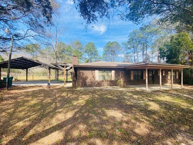 Ideally situated in the rapidly growing community of Freeport in Walton Co. 225' of frontage on Hwy 20 approx 3 miles East of Hwy 331. This location offers easy access to the conveniences of the new Publix, Ace Hardware, restaurants and surrounding communities in every direction, including the beaches of So Walton, Santa Rosa Bch, Scenic 30A, Destin, multiple military bases, the I-10 corridor, Panama City Bch and the area's newest airport- Northwest Florida Beaches International Airport (ECP)
The property has a brick home w metal roof, a custom carport, front & back porches, storage bldg, well/septic and is secured w/chain link fencing/gates. A great set up for living in w/ space for storing your RV, boat or work vehicle.