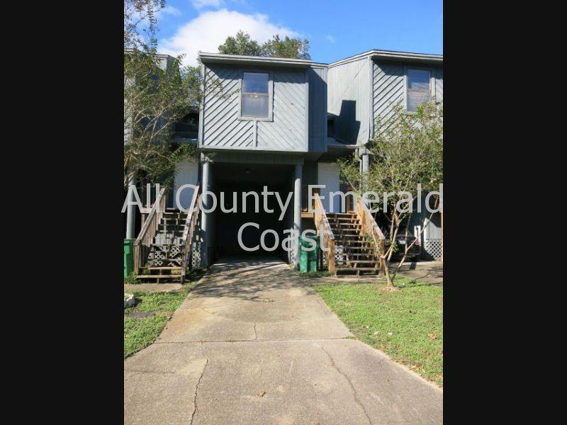 Great townhouse in Niceville located in Swift Bayou. 2 bedrooms, 2 full baths, carport and extra parking. The home features an open floor plan and breakfast bar. Nice ceramic tile throughout the house with spacious master bedroom on the first floor. The home also features 2 covered decks, down and upstairs with glass sliding doors. Sorry, No Pets Allowed. No Smoking.
