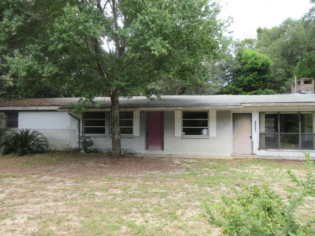 Great location for this 2 bedroom, 1 bath REO home on a 1/2 acre lot! The home sits on a corner lot directly across the street from the Bay. There are so many possibilities for this cute homeand with a little love it could be the perfect residence or rental investment. The home features a wood burning fireplace, fenced lot and plenty of room to grow. The location is close to the bay, schools, employment opportunities and a short drive to all the Resorts have to offer.