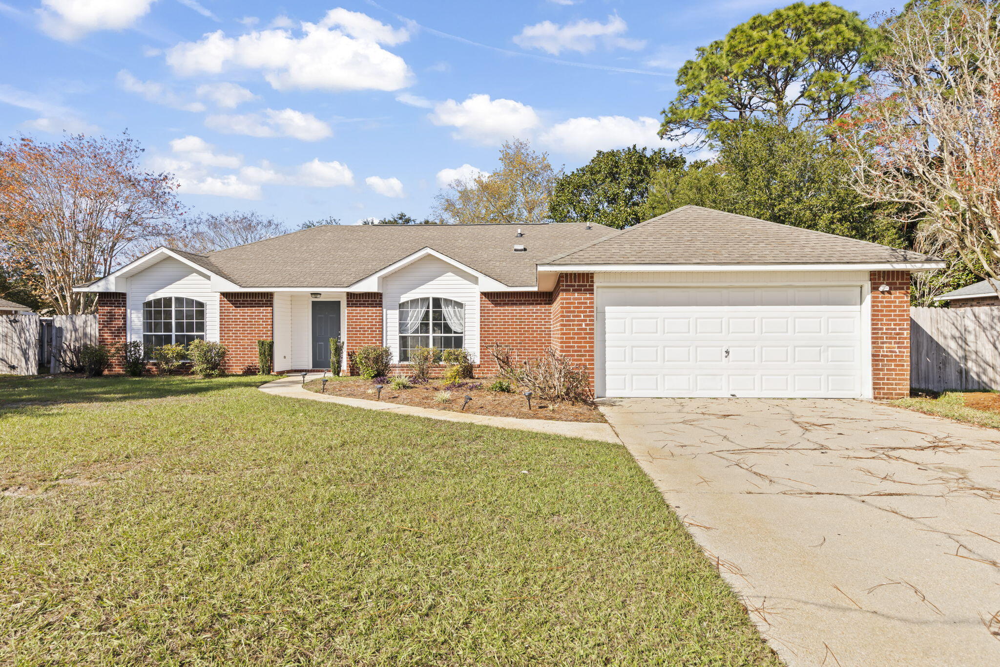 Welcome home to this beautifully updated 3BR in Raintree Estates. As you enter, you'll notice fresh paint with tile & LVP flooring throughout. The main living area is highlighted by vaulted ceilings and a cozy fireplace. The kitchen showcases stainless steel appliances, and a breakfast bar/island that's ideal for quick meals or homework sessions before dinner. The spacious primary suite is located on the opposite side of the house from the other bedrooms and features an updated master bathroom w/ large walk-in closets. The backyard is fully fenced to allow for extra peace of mind and lots of room for outdoor activities. This home is just around the corner from a neighborhood beach park with sunset memories to last a lifetime. Owner will consider pets with restrictions.  Any pet must be spayed/neutered, housebroken and current on all shots. Requires a non-refundable pet fee. Tenants required to carry renter's liability insurance. Any person at least 18 years old must apply separately. NO SMOKING! Don't miss out on the opportunity to rent this beautiful home...Call for a showing today!!