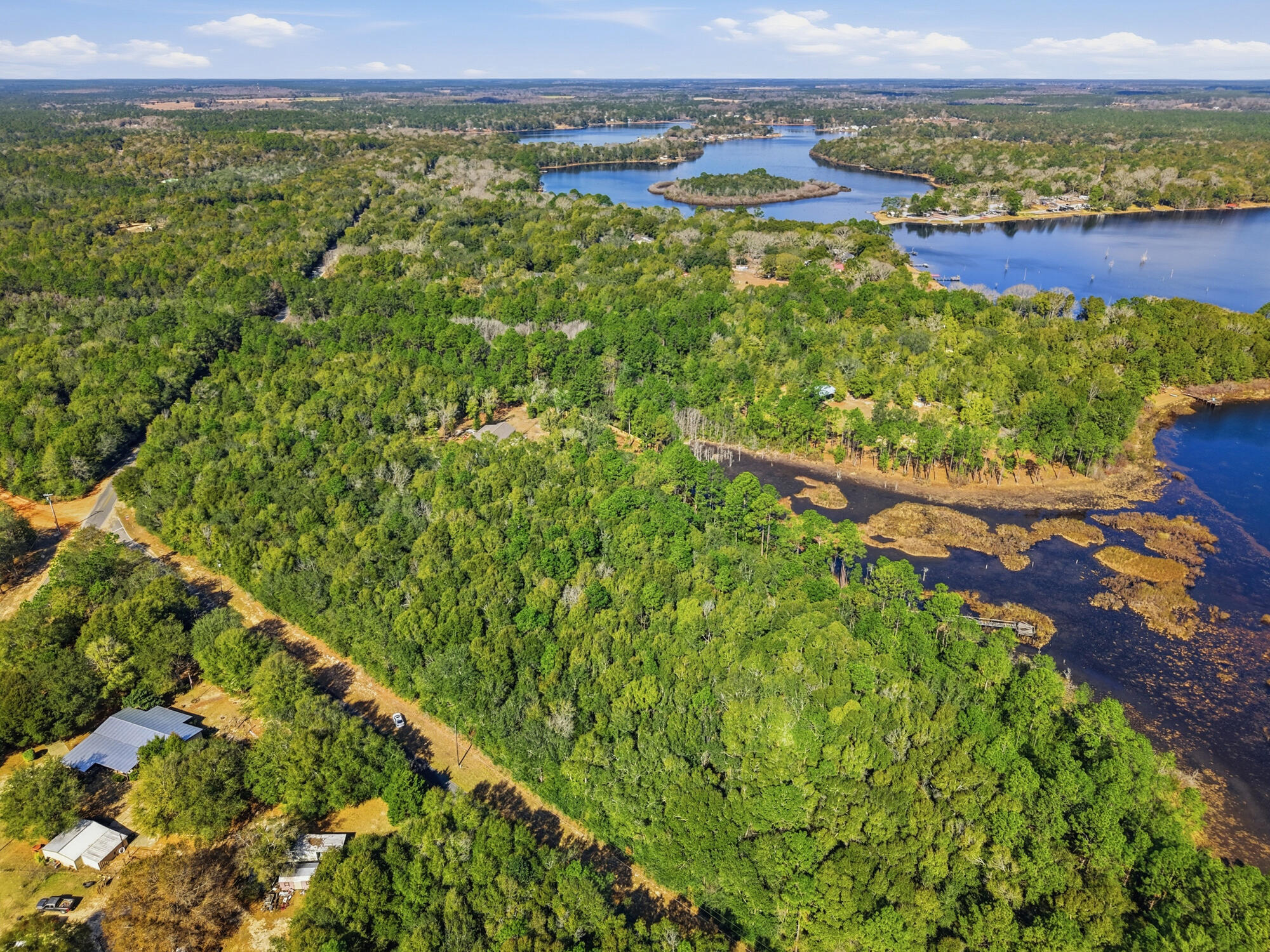 Discover the perfect blend of privacy, nature, and convenience with this beautiful 5.5-acre wooded tract featuring approximately 400 feet of waterfront on Lake Holley. With over 900 feet of paved road frontage, this property offers excellent access along with multiple potential homesites.
Enjoy peaceful lake views, mature trees, and plenty of space to create your ideal home, weekend retreat, or private getaway. Whether you're looking to build now or invest for the future, this property checks all the boxes.
✔️ 5.5 wooded acres
✔️ Approx. 400' waterfront on Lake Holley
✔️ Over 900' paved road frontage
✔️ Excellent homesite potential
✔️ Easy access to DeFuniak Springs & major shopping Zoned Rural Village-2 units per AC. Build your dream home & rental properties too!