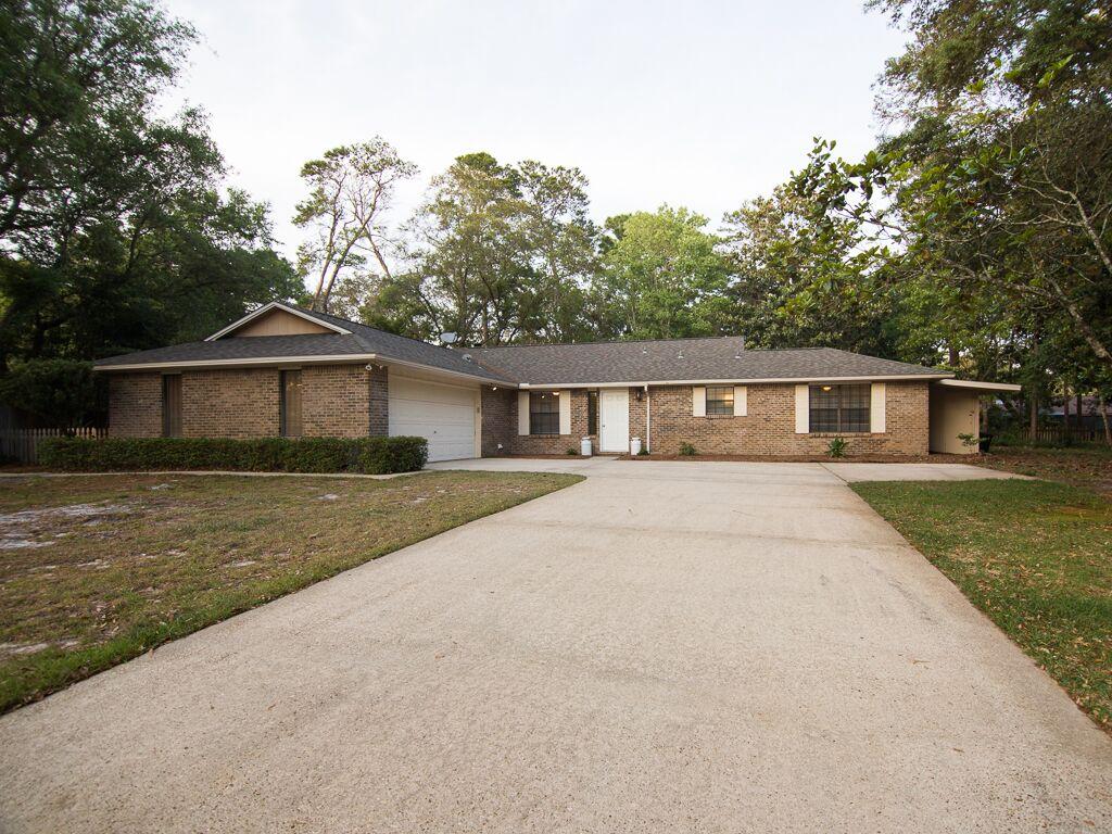 This 3bd home in sought-after Bluewater Bay won't last long! With new wood flooring in the living room, kitchen, and master bedroom, and new granite in the kitchen with classic white cabinetry and oil rubbed bronze hardware, this home is perfectly located just minutes from the white sand beaches of Destin and a short drive to Eglin AFB. Extra space off the dining room serves as a perfect office, playroom, or flex room. Add'l features include fireplace, stainless steel appliances, and an open deck. You'll enjoy a larger lot, that's hard to find with new construction, and appreciate the Bluewater lifestyle and amenities including pools, tennis center, walking trails, and quick water access. Zoned for A+ schools. Schedule your showing today!