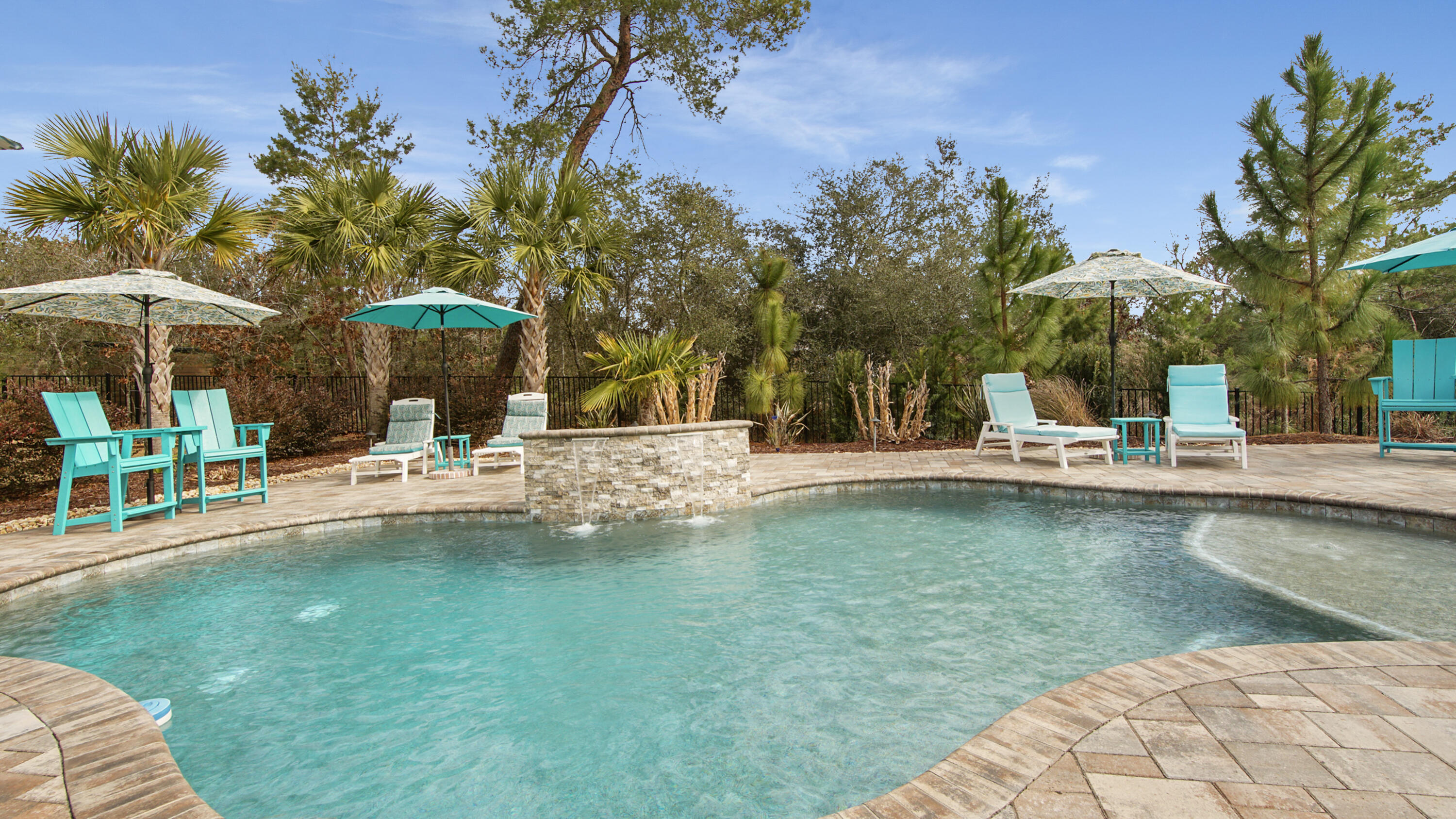 Step into your own private backyard oasis in this stunning 4-bedroom, 3-bath home located on a quiet cul-de-sac in the highly sought-after Windswept Estates. The heated and cooled in-ground gunite ozone pool is surrounded by a brick paver patio, screened-in back porch, and a paver walkway along the side of the home leading directly to the pool. The fully fenced backyard underwent a $20,000 landscaping renovation, featuring palm trees and lush flower beds that continue around the front and sides of the home, creating exceptional outdoor living and impressive curb appeal.  Inside, this thoughtfully designed home offers a desirable split-bedroom floor plan with elegant finishes throughout. The gourmet kitchen showcases quartz countertops, high-end stainless steel appliances, and ample cabinetry, opening seamlessly to the main living areas ideal for entertaining. A formal dining room and a dedicated den/office provide flexible spaces for both gatherings and everyday living. Crown molding throughout adds timeless character and refinement.

The spacious primary suite serves as a true owner's retreat, complete with an exquisite master bathroom suite designed for relaxation. Additional highlights include a large 120 sq ft laundry room and a 2-car garage with a 4-foot extension plus a separate golf cart garage, offering exceptional storage and functionality. Quartz countertops are featured in both the kitchen and all bathrooms, and the home is equipped with a security system for added peace of mind.

Windswept Estates is known for its outstanding amenities, including a championship golf course, clubhouse, resort-style pool, tennis courts, and moreproviding a lifestyle that blends luxury, recreation, and community charm.
