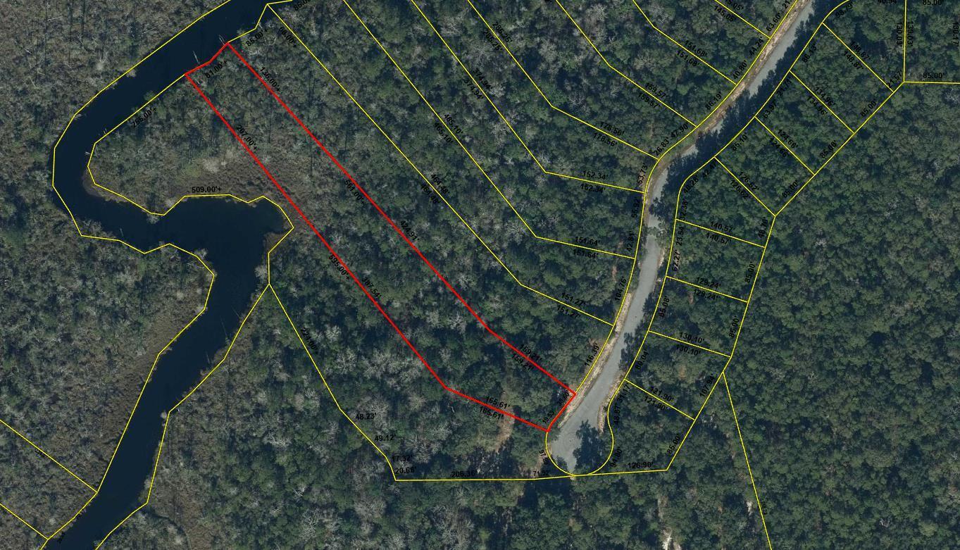Build your dream home on this 1.5 acre waterfront lot in the gated community of Magnolia Bay Estates. Enjoy 81' of frontage on Goodwin Greek - navigable to Alaqua Bayou and Choctawhatchee Bay.

32 acre of upland buildable and in Flood Zone X. Water and sewer tap fees have been paid and will convey. Connection fee due when building begins.

Convenient location in a serene setting - minutes to Freeport shopping and less than 30 minutes to the beaches.