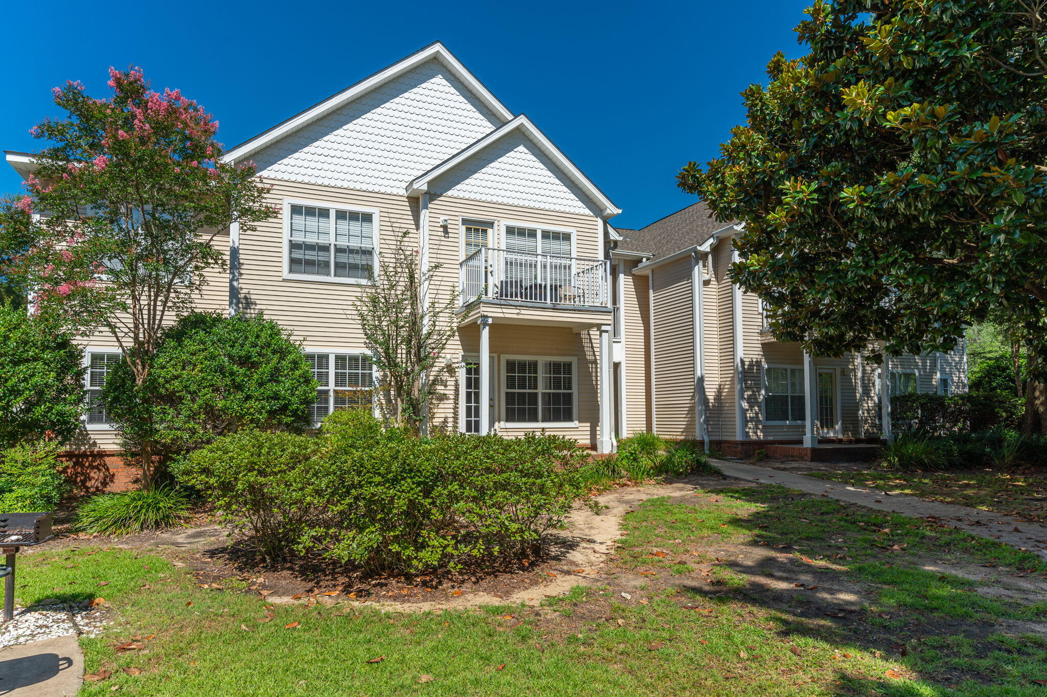 Come take a look at this immaculate first floor unit with a covered patio! You'll enjoy LVP flooring throughout with tile floors in the bathrooms. The kitchen has stainless appliances. All appliances, including the washer and dryer were new in 2021. The master bedroom has a walk-in closet as well as an adjoining bath with separate shower. HVAC is 2019, water heater is 2021 and the roof, which is the responsibility of the HOA was replaced in 2023. Enjoy the community pool, BBQ grills & gazebo areas with no yard work! Call for your showing today!