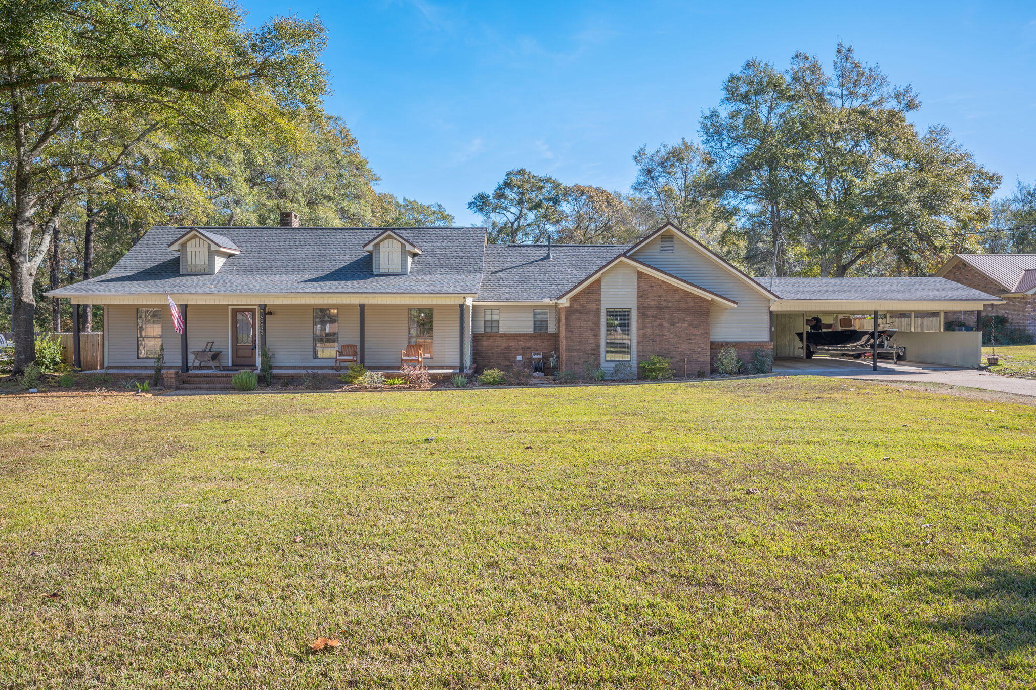 This 4 bedroom, 2 bathroom home offers space, flexibility, and country charm on a full acre — plus $8,000.00 toward buyer closing costs!
Inside, you'll find an open kitchen and living area that makes everyday life and entertaining easy. The kitchen includes plenty of prep space and a movable island that can adapt to your needs. There's also a dedicated office space, perfect for working from home or keeping life organized.
The primary suite is a relaxing retreat featuring a beautifully updated bathroom with a tiled shower and soaking tub. Outside, enjoy room to spread out with a detached garage, chicken coop with run, and a backyard fire pit ready for cozy evenings.  If you've been looking for space inside and out, this one is worth a look! Just off the dining room, the oversized living room provides a warm and welcoming atmosphere with its vaulted ceiling and elegant fireplace. This area is ideal for movie nights, gatherings with friends, or simply relaxing at the end of the day. 
One of the standout features of this home is the den/bonus rooma versatile space limited only by your imagination. Whether you need a dedicated home office, a music or hobby room, a children's playroom, or a full media room, this additional living area can easily be customized to suit your family's lifestyle.The expansive master bedroom is designed with comfort in mind, offering plenty of room for a king-size bed, dressers, bedside tables, and even a cozy chair or reading nook. It transitions beautifully into the newly renovated primary bathroom, which feels like a private retreat. With double vanities, a separate tiled shower, and a deep soaking tub, this space provides the perfect escape for unwinding after a long day.  Step outside and you'll find even more to love. The covered back porch is ideal for morning coffee, afternoon relaxation, or evening conversation, no matter the weather. Beyond the porch, the backyard offers both space and privacy, with a charming firepit area where you can gather on cool evenings to roast marshmallows or enjoy the night sky. The fenced yard makes it perfect for children, pets, gardening, or simply enjoying your outdoor space without interruption.

A detached garage provides excellent extra storagewhether for lawn equipment, seasonal items, tools, or a workshop space. The driveway accommodates ample parking, making it easy for guests to visit or for families with multiple vehicles.
This home combines comfort, convenience, and character in a way that's hard to find. With its generous room sizes, thoughtful updates, flexible floor plan, and inviting outdoor living spaces, it is truly move-in ready and waiting for the next family to enjoy.