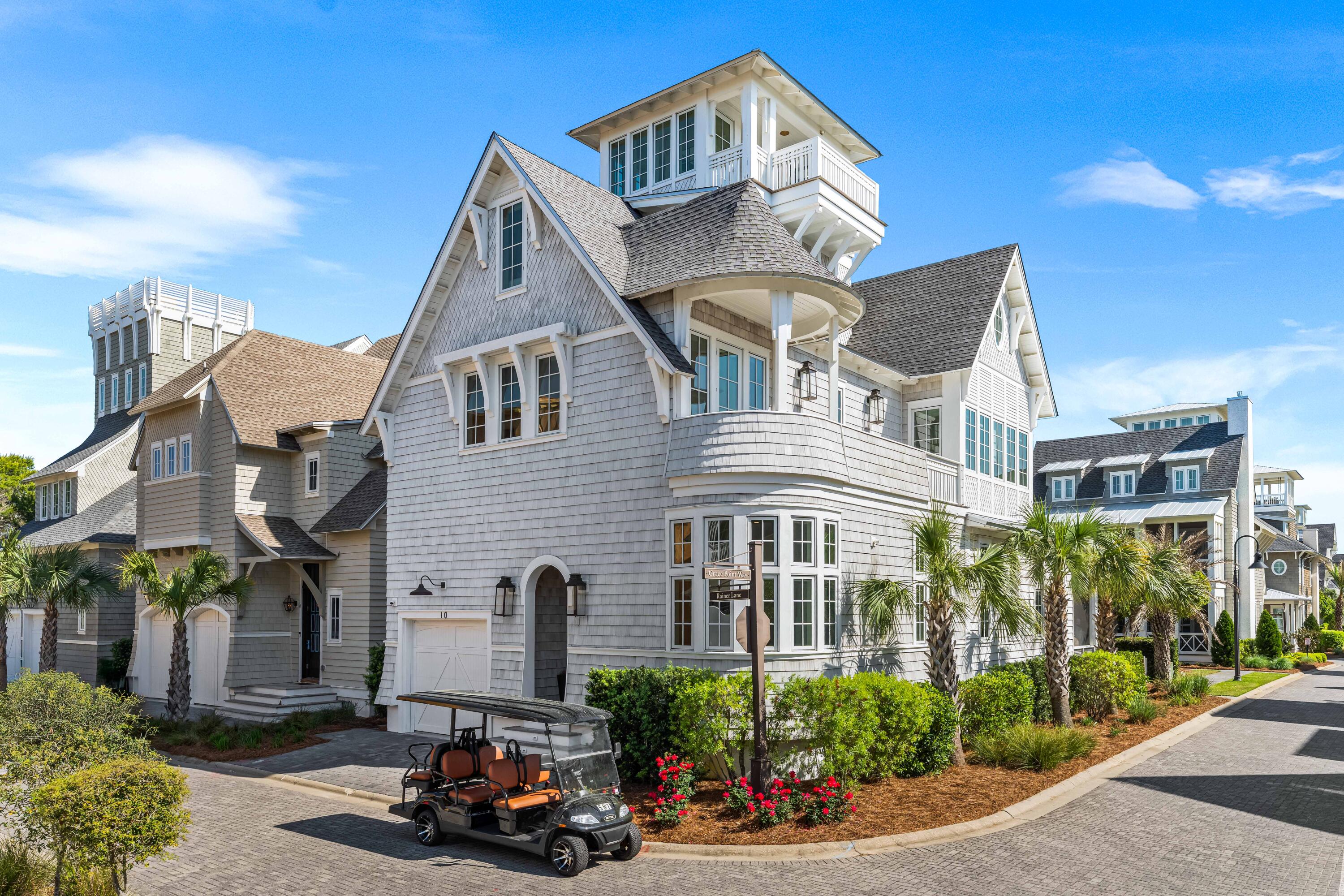 Welcome to 10 Rainer, an exceptional residence offering refined elegance, elevated design, and effortless access to the optional WaterSound Beach Club—just 600 feet away. Tucked behind the private gates of Grace Point and backing onto serene community green space, this home combines timeless coastal Nantucket architecture with sophisticated modern finishes. Upon entry, you're greeted by soaring 12-foot ceilings, shiplap walls, and rich hardwood flooring that flow seamlessly throughout. The main living space exudes warmth and comfort while offering ample room for entertaining. The gourmet kitchen is appointed with marble countertops, custom cabinetry, and high-end appliances—perfectly complemented by a summer kitchen on your screened-in porch with beverage cooler and ice maker for al fresco dining by your private heated pool.
This thoughtfully designed home boasts 4 spacious bedrooms, each with luxuriously appointed ensuite baths, as well as an oversized bunk room ideal for guests or little ones. The third-floor bonus living area provides additional sleeping space for up to three people, creating flexibility for hosting family and friends.
Ascend to the fourth-floor tower, a truly special retreat with panoramic Gulf views from multiple angles. This versatile space includes a dry bar with a built-in beverage cooler, making it the perfect spot to unwind at sunset or entertain in style.
The primary suite, located on the second floor, is a sanctuary of its own with a private balcony, dual Carrera Marble vanities, a garden tub, and a generously sized walk-in showera spa-like escape after a day in the sun.
Situated in the heart of Grace Point, a coveted community along iconic Scenic Highway 30A, this home is mere steps from The Big Chill and adjacent to the exclusive WaterSound Beach Club, offering an unmatched blend of coastal luxury and convenient access to premier dining, shopping, and entertainment.
Renters have the opportunity to join the WaterSound Club with multiple amenities to members including private beach access, beach services, swimming pools, dining, two private golf courses, and the brand-new Lifestyle Center at Camp Creek.