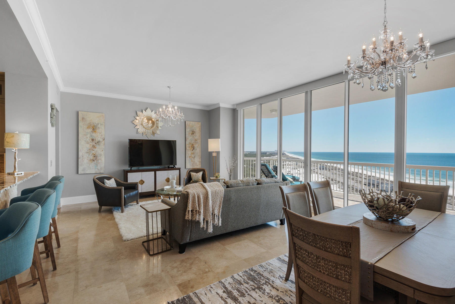 Incredibly gorgeous, totally renovated, 3 bedroom, 3 -1/2 bath penthouse with an oversized two car garage, two expansive terraces and miles of incredible views. St. Barth at Silver Shells is a premier short-term rental restricted luxury condo located next to Henderson Beach State Park providing endless unobstructed views down the eastern coastline of the Gulf of Mexico. The photos speak for themselves but rest assured, no expense was spared in this top to bottom renovation to include: polished travertine flooring in the foyer, living/dining area, kitchen, hallways, & stairway to the master; hardwoods in all bedrooms; new granite throughout; custom cabinets in kitchen, wet bar & master bath; custom backsplash & bar front; paint & crown molding; all new sinks & frameless shower enclosures, light fixtures; new furnishings, artwork, accessories & window treatments; new TV's throughout; two Trane HVAC systems; custom closets; LG washer/dryer; plus so much more. Every single room in the condo has a view of the gulf. There is a wall of windows in the living/dining room area opening to a 38 x 10 ft. terrace. Both guest bedrooms with ensuite baths, located on the first floor, have sliding doors leading to the terrace. Walk up the beautiful travertine stairway and enter the 1100 sq. ft. master suite with another wall of windows leading to a 595 sq. ft. terrace with a hot tub. There is a spacious master bath and a huge custom closet. The views from this penthouse are too incredible for words! In addition, St. Barth offers a lovely lobby, pool and hot tub, outdoor grill area, climate-controlled storage and a guest suite for owners use. Silver Shells is a 27+ acre gated resort with over 1000 ft. of beach frontage. Amenities include: lagoon pool, indoor/outdoor pool, cardio & weight rooms, 4 tennis courts, basketball court, playground, day spa and Ruth's Chris Steakhouse.