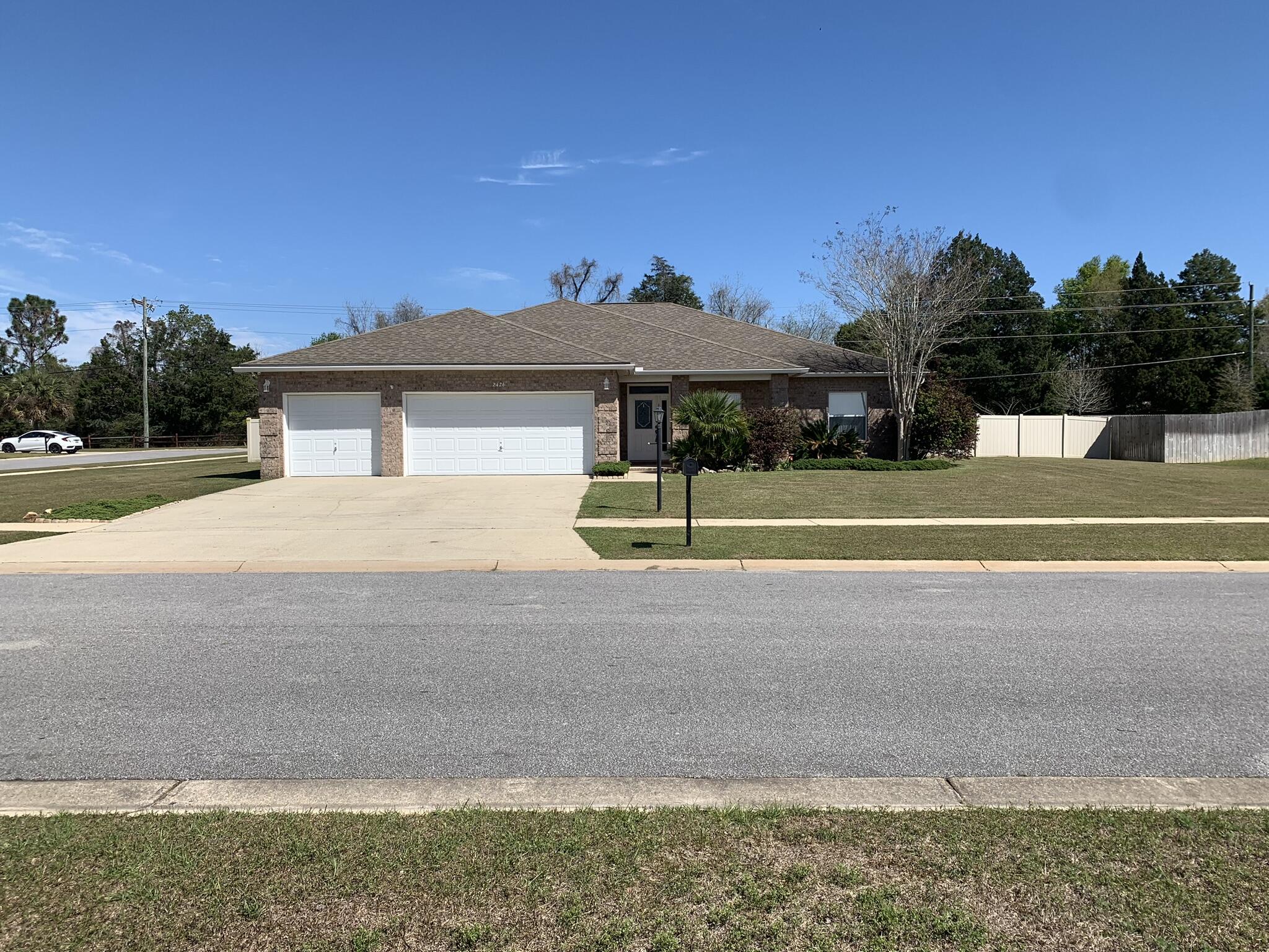 Beautiful, updated 4 bedroom, 3 bathroom house with huge yard. This nicely landscaped contemporary home has wood look tile flooring, stainless steel appliances, 2 bedrooms with a jack and jill bath, large master bedroom, and oversized and extended 3 car garage!!! This is a must see! This home also has his and hers closets in the master bathroom, a large screened lanai, and sprinkler system!! The pictures speak for themselves!! Come see this one today!! Call the office to schedule a showing appointment.