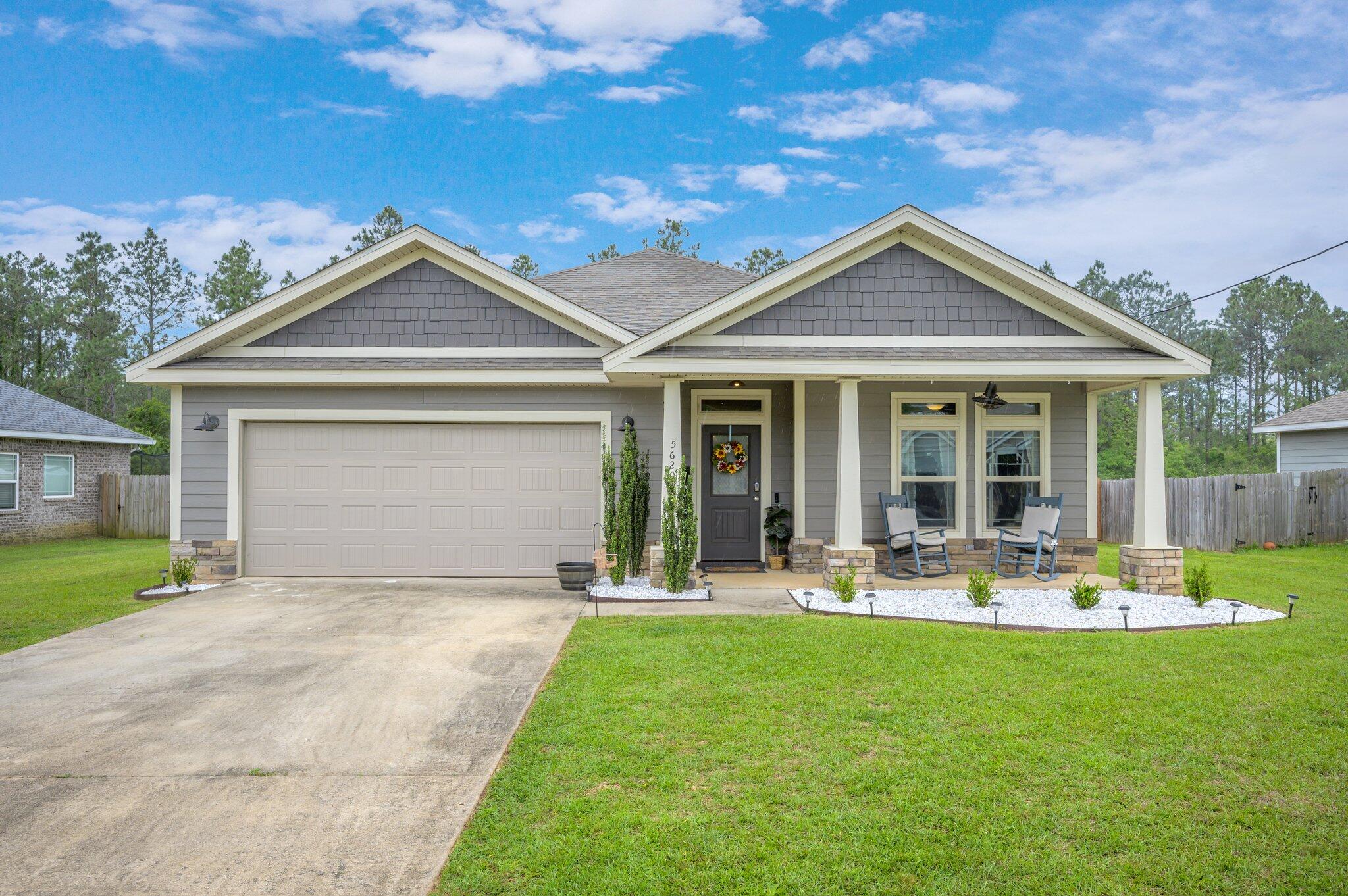 Beautifully upgraded 3-bedroom, 2-bath home located in Baker with a convenient commute to local military bases, beaches, and shopping. This well-maintained home features a large living room and an open-concept layout with the kitchen opening directly to the living area, creating an ideal space for everyday living and entertaining. The kitchen is equipped with granite countertops, a custom tile backsplash, stainless steel appliances, and a bar-height counter seating area—perfect for hosting friends and family while still keeping an eye on the little ones. Ample cabinet and counter space meet all your cooking and storage needs.The home continues to impress with 9-foot ceilings throughout and a spacious primary suite that serves as a relaxing retreat, complete with a large walk-in shower in the master bath. Additional upgrades and attention to detail can be found throughout the home, offering a comfortable blend of function and style. Located in a desirable Baker area, this property provides both peaceful living and easy access to everyday conveniences.