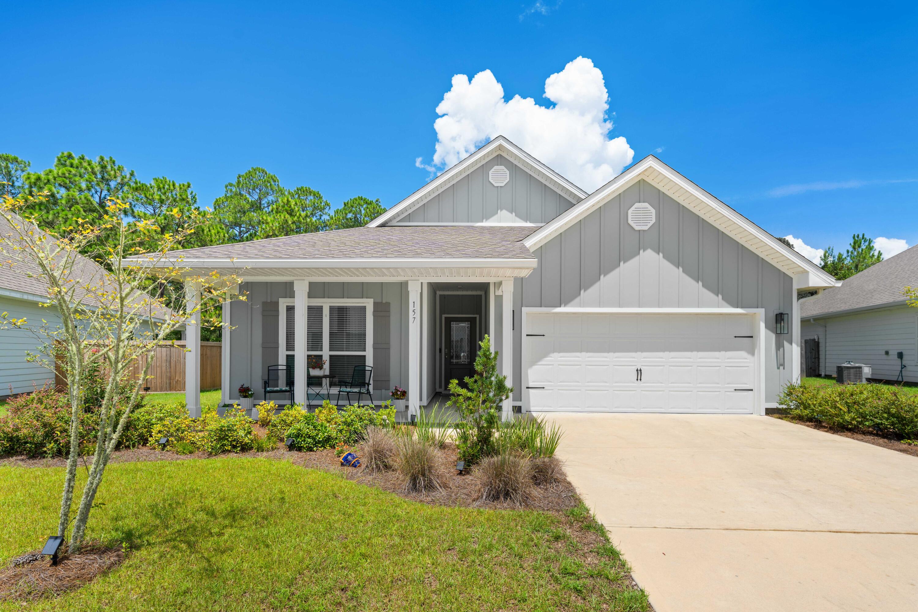 Timeless elegance can be found in this well maintained craftsman style home located in The Preserve at Paradise Cove in Point Washington. Backing up to a wooded preserve and surrounded by lush landscaping, this 4 bedroom, 2 bath and 2-car garage home offers year-round privacy and relaxation. Experience the ease of convenience with quick access to the Choctawhatchee Bay, South Walton's white sand beaches, HWY 30A, Eden Gardens, as well as numerous hiking and biking trails. Featuring stainless steel appliances, professional lighting, screened back porch, outside gutters, smart home technology package, shaker style cabinets, stunning finishes and fixtures, quartz countertops, and wood-grain EVP flooring throughout. Claim your private oasis amongst Point Washington's natural beauty today! Additional property features include 9' ceilings, stainless steel appliances, quartz countertops throughout, smart home technology package (KwikSet keyless entry and Skybell doorbell), automated front porch lighting, Echo Dot device plus Quolsys touch panel that can be integrated to control home's lighting, thermostat, front door and more. The Preserve at Paradise Cove is a charming community located in Santa Rosa Beach, FL and offers peace, quiet, and convenience being a short drive to 30A's white sand beaches, top-rated schools, Choctawhatchee Bay, numerous state park trails, Destin, Panama City Beach, and more. Claim your retreat in The Preserve at Paradise Cove today and enjoy the best of coastal living!