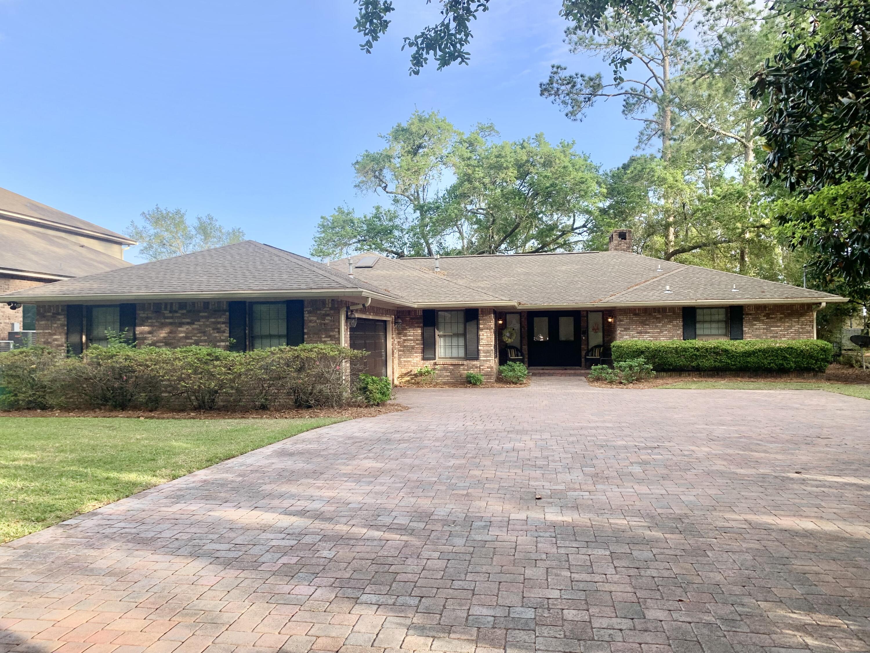 Spectacular, open waterfront with 125 ft on the bay! 3 bed, 2 bath with living rm, dining rm, Florida rm, kitchen, laundry room, screen porch, 2 car garage, HUGE lot with 2-story dock and double jet ski lift. Since 2011, upgrades include new roof ('11), flat ceilings,new dock w/ lift ('12), new tile flooring throughout ('12 and '17), updated kitchen & master bath ('12-'13), new paint, crown molding ('12-'13), whole house interior new paint ('18), custom cabinetry in garage ('16), brick paved driveway ('15), brick paved screened patio and brick paved open patio ('15), brick fire pit ('16), new HVAC ('15), new water heater ('12), new walk-in shower in bath 2 (2021), updated laundry ('12), backyard lighting added. Termite bond, floored attic. New backyard Zoysia ('21).