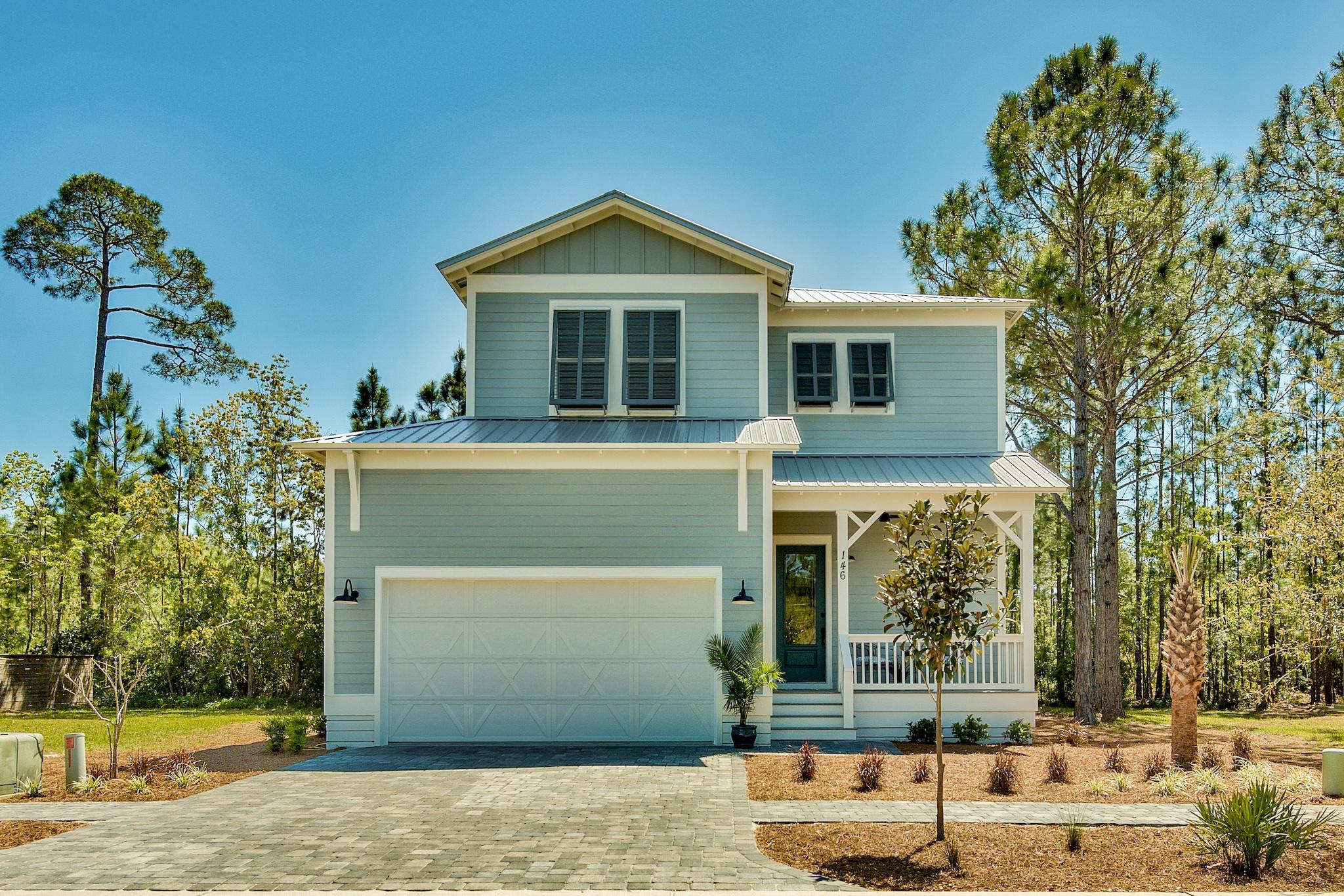 NEW CONSTRUCTION/ 4 bedroom with Master down in Hidden Grove, a gated community with a fabulous community pool. Home is solidly constructed with 2X6 framing, 8 Ft. Low E impact doors, and Low E impact windows, low maintenance Hardi board lap siding, metal roof, and an impact/wind rated garage door. Forget having to cover your windows in a storm, this is a lock-and-go home. Interiors are upgraded from the typical builder grade home. Home is well insulated, has Energy Star Frigidaire Gallery series appliances. Oven is a slide-in range with convection oven. Hot water heater is 50 gallons. Home is essentially GREEN, and it backs up to a preserve so you will not have neighbors in your backyard. Enjoy your privacy on the covered back porch. Click the ''More'' button and read on. Additional details: Home has two 14 seer energy efficient American Standard HVAC units. This is 4 bedrooms 3.5 baths in 2,488 Sq Ft. and a two car garage. Three additional bedrooms upstairs, one with in suite full bath with tub/shower.  Other two bedrooms share a full bath with tub/shower combo. NO CARPET in this home, all flooring is either hardwood, or ceramic tile flooring. Open concept plan with foyer walls clad in shiplap siding. All cabinets are DLV (Deorative Laminate Veneer full overlay) which is an upgrade and stronger than painted cabinets, with Shaker style door in popular silver grey color. All counter tops are white quartz. Plumbing and lighting fixtures are designer grade fixtures. Ceilings are 10 Ft. high throughout. First floor hosts the foyer, powder room, kitchen, dining and living room, Master bedroom and bath  and lighted storage under the stairs. Full walk-in laundry is on the the first floor. Laundry has 42" cabinets and deep laundry sink with hand spray to wash your pets. Closet space galore in each bedroom. Home has a covered porch both front and back with maintenance free Trex type decking and exterior fan. All landscaping has heat tolerant native grasses, plants and trees. Lot irrigated and covered in pine straw. You don't have to mow anymore! Community has a large pool with bath houses, and central mailboxes. Your new home is short walking distance to the community pool. It's like having your own private pool without the hassle. There are two public areas to launch your boat just minutes away. Low association dues of $240 quarterly. Gated, attractive community is just a little more than a mile north of the Santa Rosa Beach Wal-Mart, and a short drive to Sacred Heart and Publix. Looking to work or play on 30A. You have easy access to 98 with a stop light at W. Hewitt and Hwy 98. You can be on the west end of 30A in 5 to 7 mins. Builder purchased extended warranties on all kitchen appliances. Property in flood zone "X", no flood insurance required. Not in COBRA, can do VA and FHA lending. Home being sold unfurnished. Buyer to verify any and all information important to buyer. There is a one time capital contribution fee of $160 and a $250 transfer fee to the HOA.