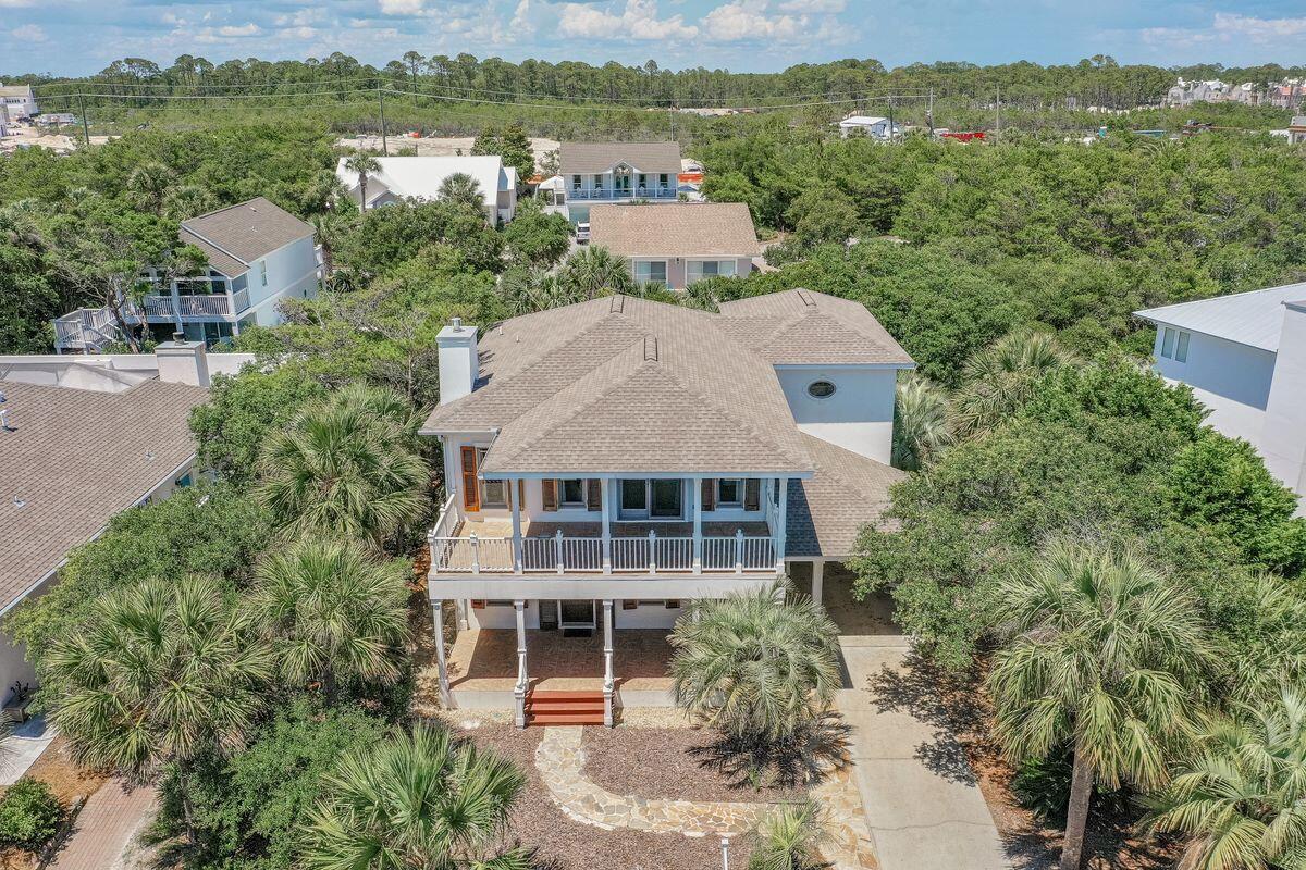 Beach lovers do not miss this 2,462-sq.-ft. home just three houses from a quiet stretch of beach in the private, non-rental community of Sand Cliffs on the Gulf; Located on the south side of Scenic Highway 30A. This three-bed, two-bath retreat features an elevator and two workspaces. Guest accommodations on the ground floor and a second kitchen in the owner's suite on the second floor. Workshop, shaded backyard and hardwood flooring.  Located at Scenic Highway 30A and WaterSound Parkway within walking distance of Kaiya, Seacrest Beach and Alys Beach. Close proximity to Highway 98. You can venture to the area's best dining and shopping by foot or bicycle.  shopping and entertainment options.