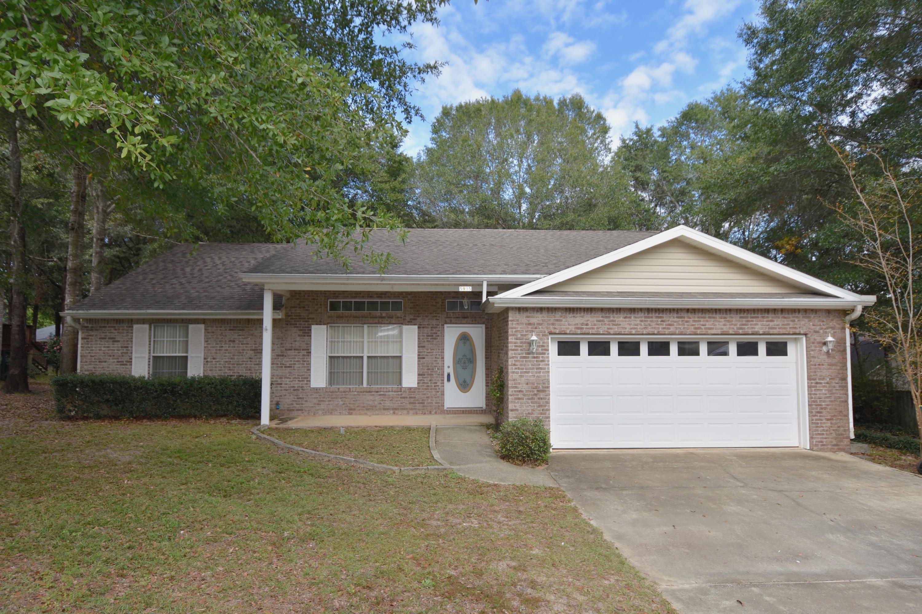 Attractive and affordable! This all brick home is located in a quiet subdivision on a low traffic street. 10' Raised ceiling in the Living Room and open floor plan has a country Kitchen with breakfast bar. Tiled flooring in the entry, Kitchen, Dining area and both bathrooms. Split bedroom design. Cultured marble vanities in both bathrooms + a cultured marble whirlpool garden tub with tile surround & glass block window in the Master bathroom. Oversized Master bedroom has a walk-in closet. Both sides and back are fenced by the adjoining owners so it should be easy to enclose the back yard for your little ones to play. 1 year home warranty provided by seller, $450 Value. 2-Car attached garage + 16x20 detached garage workshop with a single garage door. Oversized patio, deck + large front porch