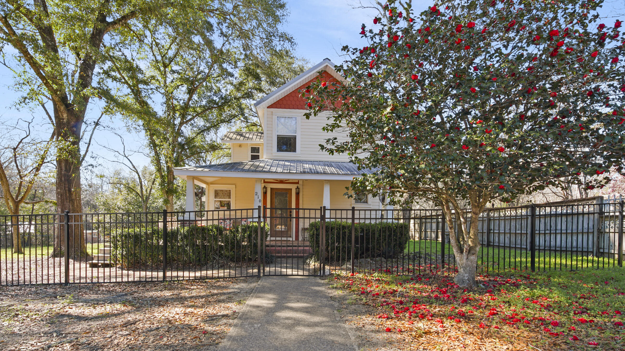 Step into this upgraded three-bedroom, two-bathroom, two-story charming historic cottage and notice the open floor plan which perfectly blends modern
comforts and historic integrity. The primary bedroom is located on the ground floor with gorgeous hardwood flooring, offering a much-needed escape from the hustle and bustle of everyday life. The upgraded kitchen features steel appliances, and a breakfast bar, along with both updated lighting and cabinets.
As you make your way to the backyard, you'll be greeted by a spacious and fully wrought iron fenced yard, perfect for outdoor activities with family and friends. This lovely property is 3 blocks from the historic Lakeyard around Lake DeFuniak  and the newly rejuvenated Baldwin Avenue!