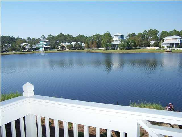 Price Reduced! Welcome to the best view in Crystal Cove located on one of the only natural lakes in Sandestin. This DOWNSTAIRS END unit with 2 bedrooms and 2 baths is that bright, airy open floor plan that everyone is wanting. Lots of windows flood it with sunlight and make every room feel inviting. It will be a perfect second home or an investment property. Condo has an assigned parking spot. Listing price is condo furnished.
Your over-sized deck goes the entire length of your living room and dining room and is an ideal spot to entertain or just kick back and enjoy a great sunset. It's all about location and you can't beat this one. This one won't last so call today.Another great benefit to owners and guests is the ability to have exclusive use of the Mack Bayou gate to get to Highway 98 in less than 3 minutes.