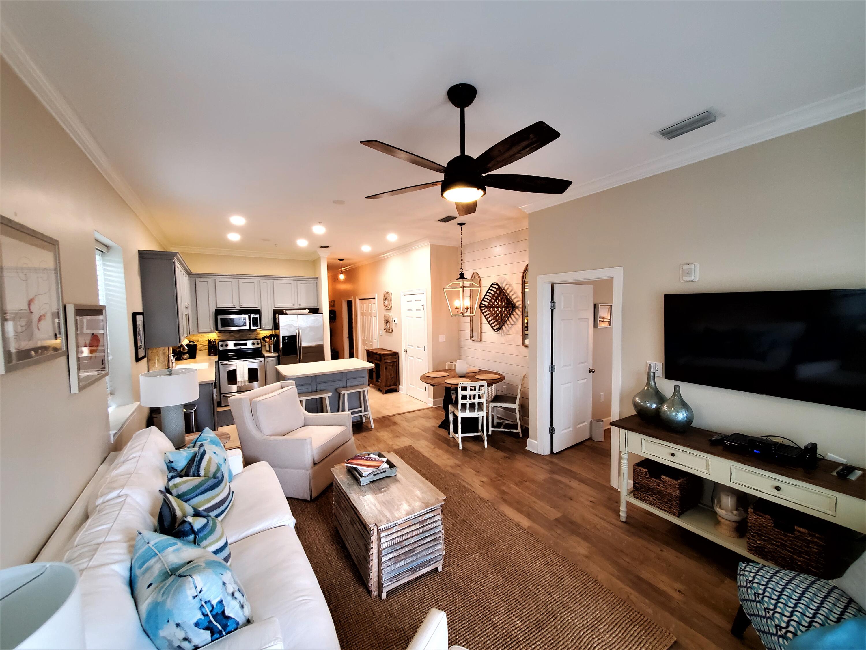 STILL TAKING BACKUP OFFERS - EASY SHOW. Beautifully upgraded end unit condo with additional windows, 10' ceilings with crown molding in main area, upgraded painted cabinets with under and above accent lighting, stainless steel appliances and mosaic tile backsplash in kitchen. Travertine and luxury wood vinyl flooring throughout. Shiplap accent walls in the café area and the master vanity add a handsome touch. This unit has only been rented to friends and family but is being sold fully furnished and would make a perfect rental income, second home or residence. The current owners love the easy access for loading/ uploading and not having to deal with stairs or elevators. Seagrove Highlands is gated and tucked away from all the 30A hoopla, but is close and convenient to beach access, bike path, neighboring restaurants, shops, entertainment, and everything the 30A lifestyle has to offer. Come and see. This well cared for upgraded unit is waiting for you.
