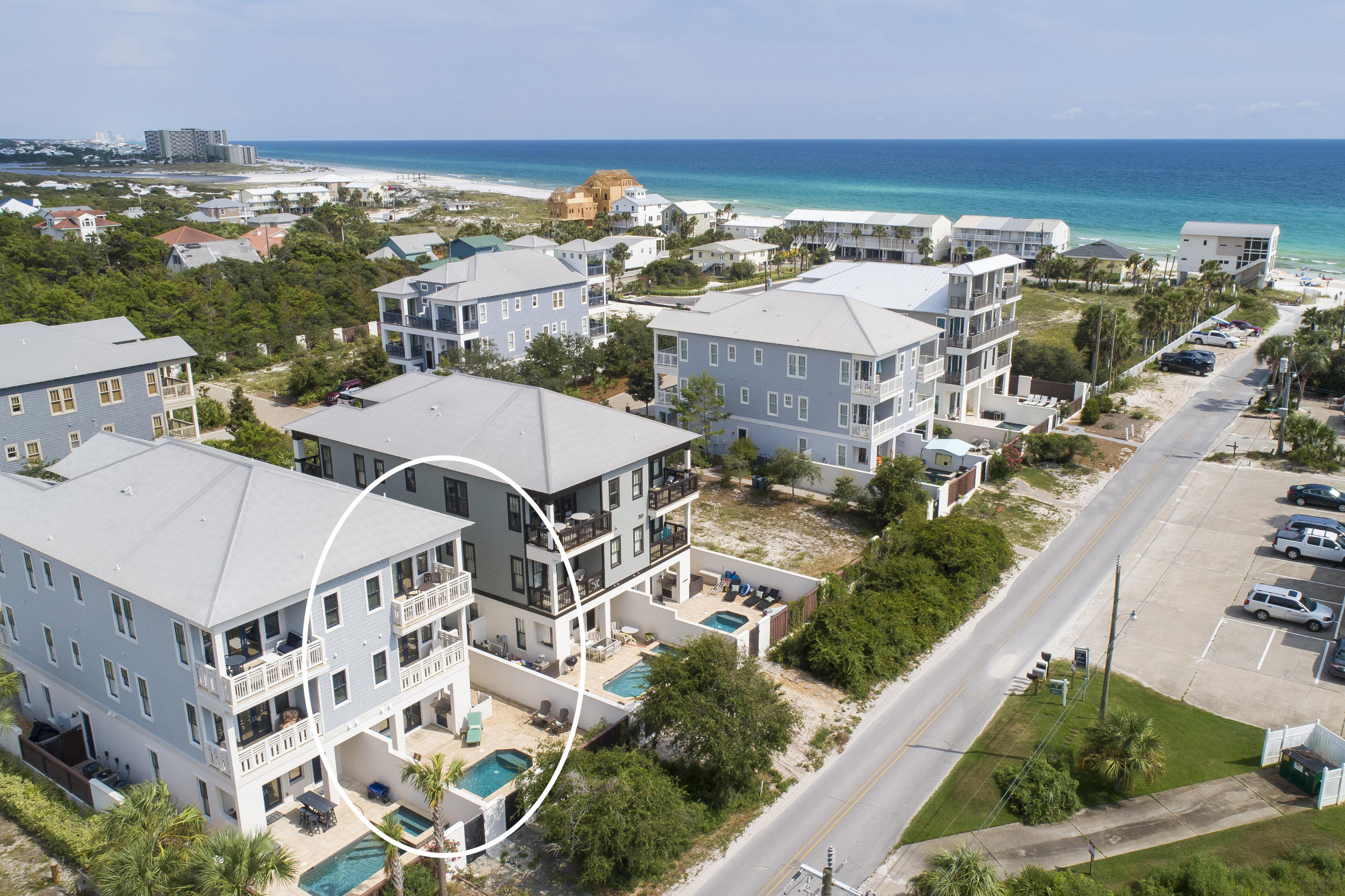 Luxurious living just steps from the Beach! With fabulous views of the Gulf, three levels of living and a gorgeous farmhouse-beach-chic feel, this stylish home is ready for it's new owners. Move-in ready, all new furnishings await while the home has been freshly painted inside and out. Sweeping water views are on offer from the 2nd and 3rd floors while the first floor is a studio apartment with a sleeper sofa and Murphy bed! Plus a full kitchen and a full bath with shower. Throughout the layout, there are three masters with ensuite baths, plus a bunk room with a full bath/tub meaning this home can comfortably sleep up to 14 guests. If you need more space, the heated and cooled garage can be set up as a game room. An elevator provides easy access to all three levels and you are sure to love the private, heated pool and courtyard.  Walnut hardwood floors, shiplap feature walls and an extra office are just some of the additional features.  Main kitchen features a Wolf gas stove, a beverage fridge, farmhouse sink and granite counters, main kitchen has dual dishwashers and a Pro Series fridge.  Located within a gated community just steps from the public walk out to the beach, this home is perfectly positioned to be used as a rental if your searching for an investment opportunity.  Buyer is to verify all information contained in this listing.
