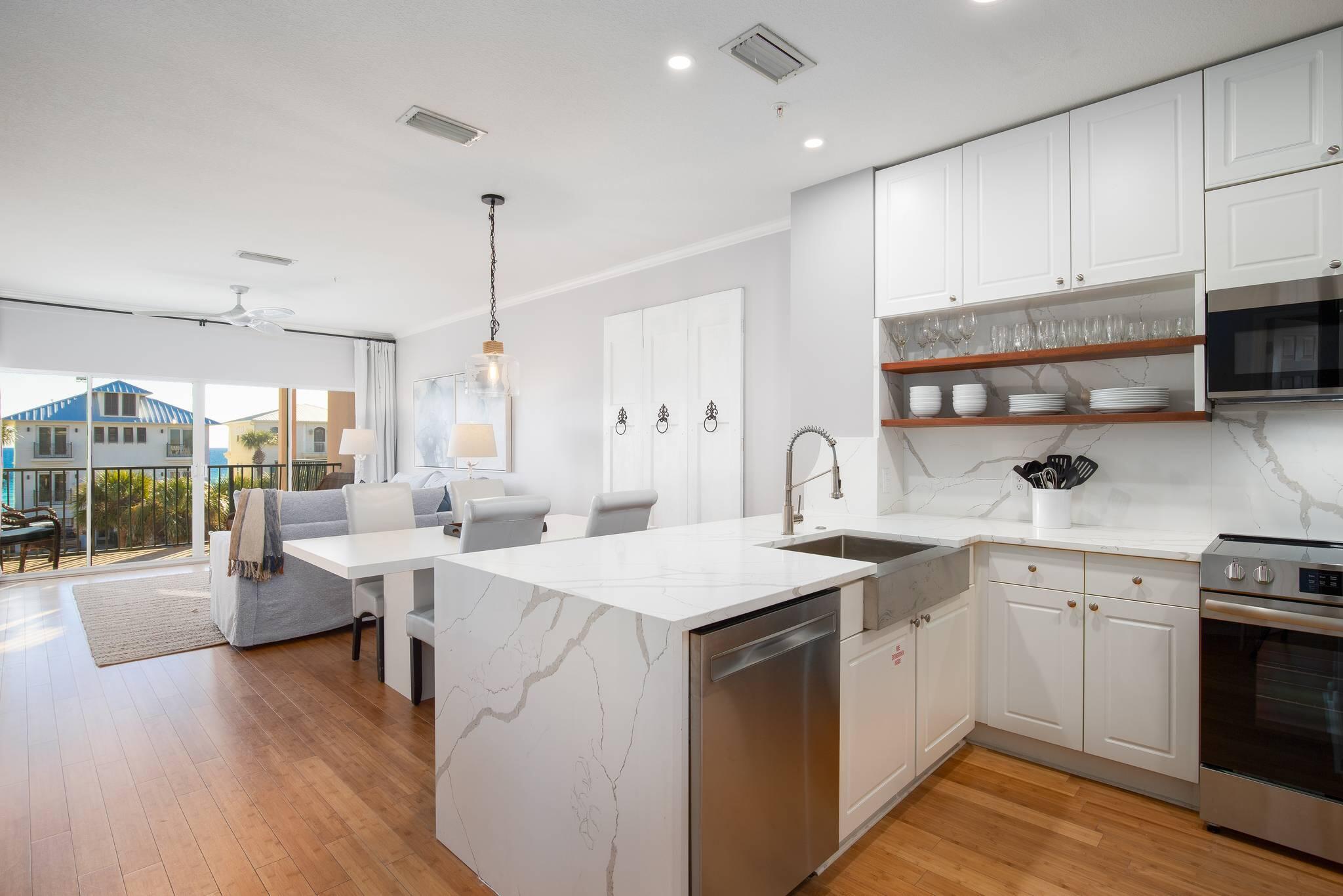 Step inside this coastal retreat that will capture your attention from the moment you walk through the door.

This gorgeous two-bedroom, two-bathroom condo sits on the third floor of the sought-after Emerald Waters complex, offering a taste of the Florida beach lifestyle you've been dreaming about. The recent renovation has transformed this space into a stunning turnkey escape, complete with elegant waterfall countertops that catch the light and stylish bamboo flooring that whispers barefoot luxury with every step.

The primary bathroom renovation is nothing short of breathtaking, featuring exquisite finishes that elevate your daily routine into a spa-like experience. Every detail has been thoughtfully curated to blend coastal elegance with modern sophistication, creating a sanctuary where you can unwind after sun-drenched beach days.

The open and airy layout welcomes you with generous windows that pour sunshine throughout, while your private balcony becomes the ultimate spot for morning coffee with a side of ocean breeze. The partial Gulf views and pleasant coastal vantage point deliver that beach ambiance you're seeking.

Sandy toes are practically guaranteed with deeded beach access just steps away. When you're ready to explore beyond the shoreline, you'll find yourself wonderfully positioned near local favorites like Pompano Joe's for fresh seafood and tropical drinks. The nearby Miramar Beach Regional Access offers additional coastal enjoyment, while Silver Sands Factory Stores provides excellent shopping opportunities. Whole Foods Market ensures your kitchen stays stocked for beachside entertaining.

This turnkey property arrives fully furnished and rental-ready, making it an exceptional opportunity for generating vacation rental income or enjoying your own slice of paradise whenever the mood strikes.

Don't let this coastal gem slip away. Schedule your private showing today and start living the beach life you deserve.