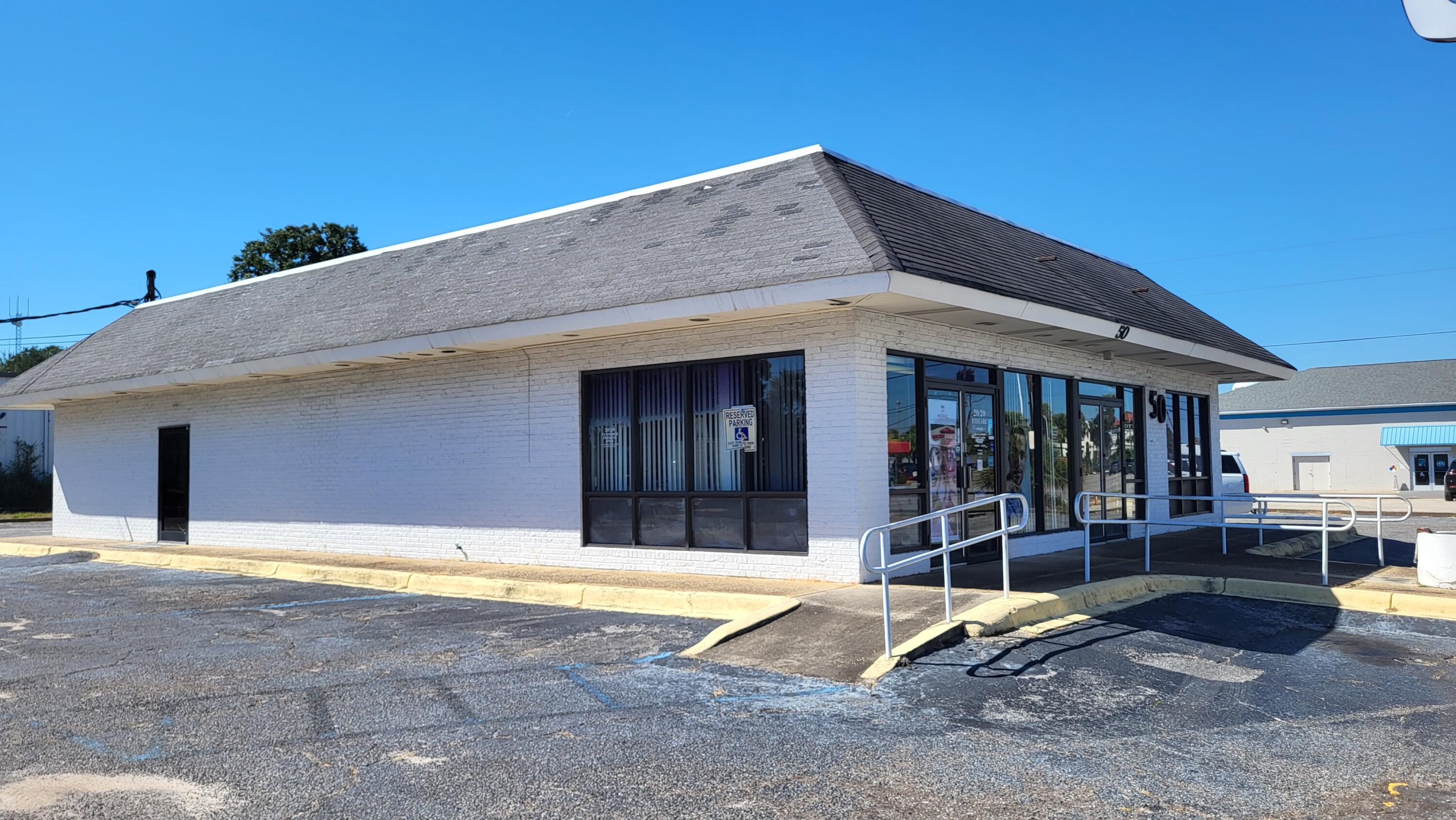 Land area is 0.68 acres with 187' of street frontage and building is 2,776 sqft. Owner plans to move business into a smaller building. Building was originally a McDonalds built in 1960. Presently used as an optometrist eye doctor business. Located next to new 7 Brews Coffee, across the street from McDonalds, Popeyes, Taco Bell, and Tijuana Flats. Within 1 1/2 miles of the Gulf and white sandy beaches.  Do NOT disturb the business or go into the business without prior appointment with listing agent.
