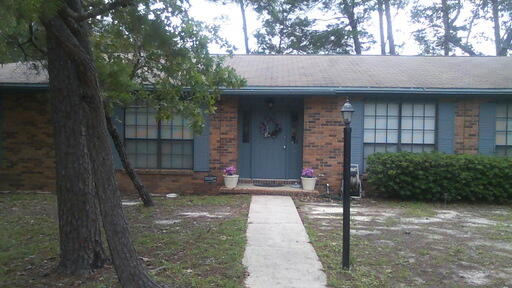 Spacious Bluewater Bay home located on a large corner lot. This fine home features two living areas, large laundry room with half bath, fenced back yard and a two car side entry garage. Wood burning fireplace in the family room located just off the kitchen.