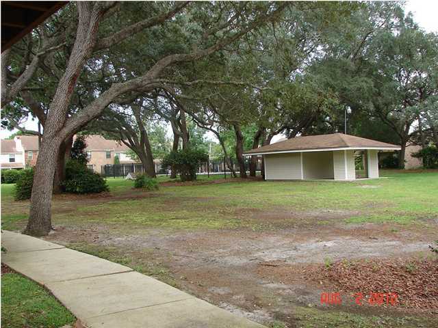 Townhomes are built around a beautiful courtyard with swimming pool. Townhome has a wood deck surrounded by a privacy fence. Garage door opener, washer dryer area, nice appliances. The pool is visible from this unit.