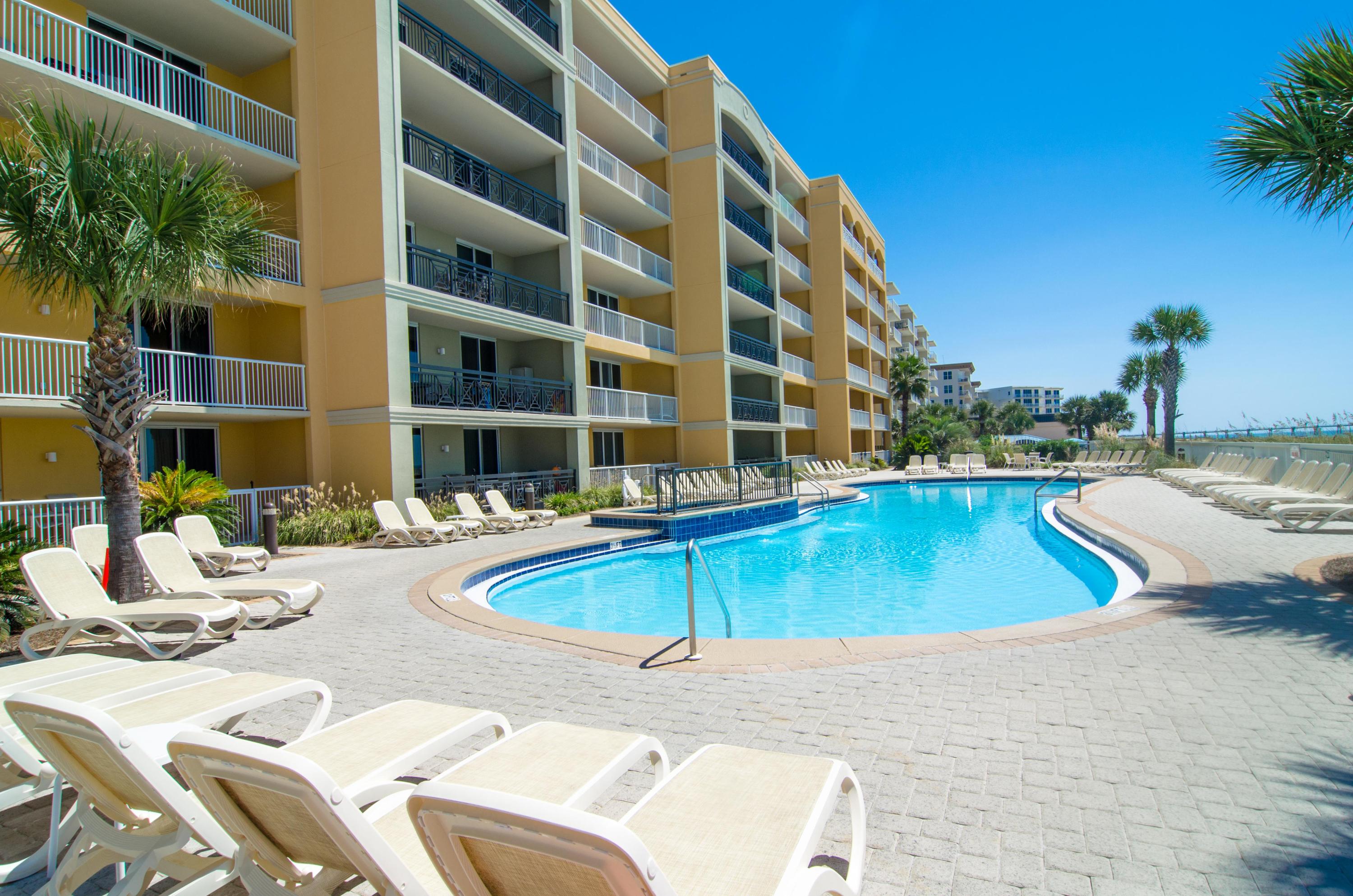 Azure is the crown jewel of Okaloosa Island and this stunning coastline view 3 bedroom condo at Azure is one of the reasons why! Upgrades include tile or wood laminate floors throughout ENTIRE condo (no carpet!) stainless steel appliances, granite counters, beautiful furnishings and a large balcony to soak in all the views. The Master Suite is Gulf front and has balcony access plus a spa-like bath with soaking tub, separate shower and his/her closets. This condo is a rental powerhouse, grossing up to $50K! Imagine one of the area's most luxurious condominium complexes with every amenity desired including 2 pools, 2 hot tubs, a spray park, fitness center and a large boardwalk to access the beautiful beach. This is a turn-key property - all you need is your bathing suit!