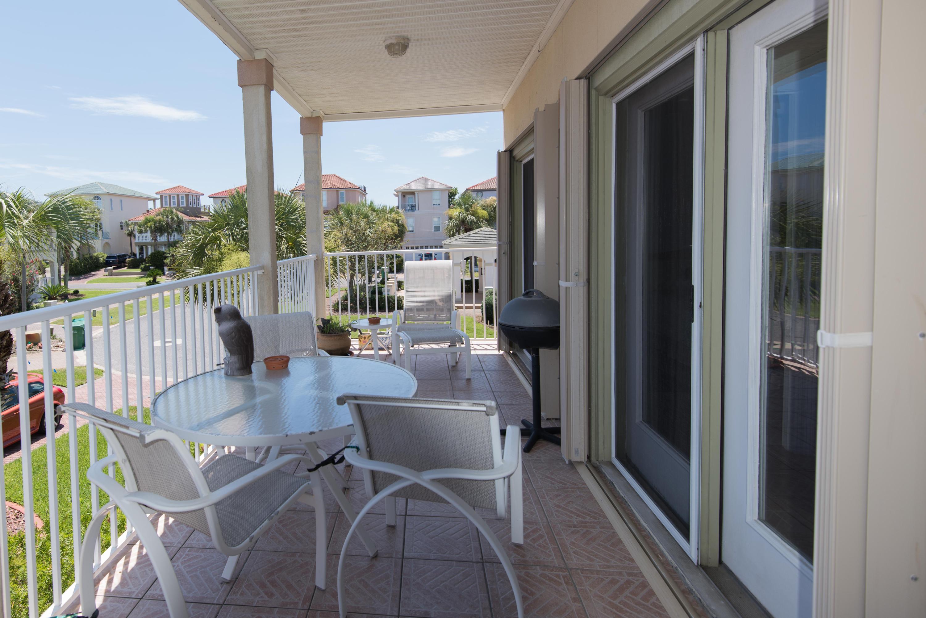 MOTIVATED SELLERS! Beautiful 4 Bedroom 3 Bath custom built home in a fabulous location very near the Gulf with Deeded Beach Access, Tennis Courts, Volley Ball, Fitness Center & Community Pool. Rental Projections in the $80's! Porcelain Tile throughout entire house with Wood Stairs. 1st Floor Master with Porch & HUGE His/Her Closets. Oversized 2 car garage with large storage closet and extra area for Golf Cart! 2nd Floor Main Living area with beautiful Kitchen & Dining. 2nd Bedroom & Bath and spacious Laundry Room! Screened Porch off Living Room. 3rd Floor contains 2 more Bedrooms & Bath as well as Large Sitting & Office area also with a Porch! Double Stucco. Hurricane Shutters on all windows & Glass doors! New AC 2017 with Ultra Violet Lite. Ceiling Fans throughout, Extra high Railings. upgrades throughout!  Being sold mostly furnished!