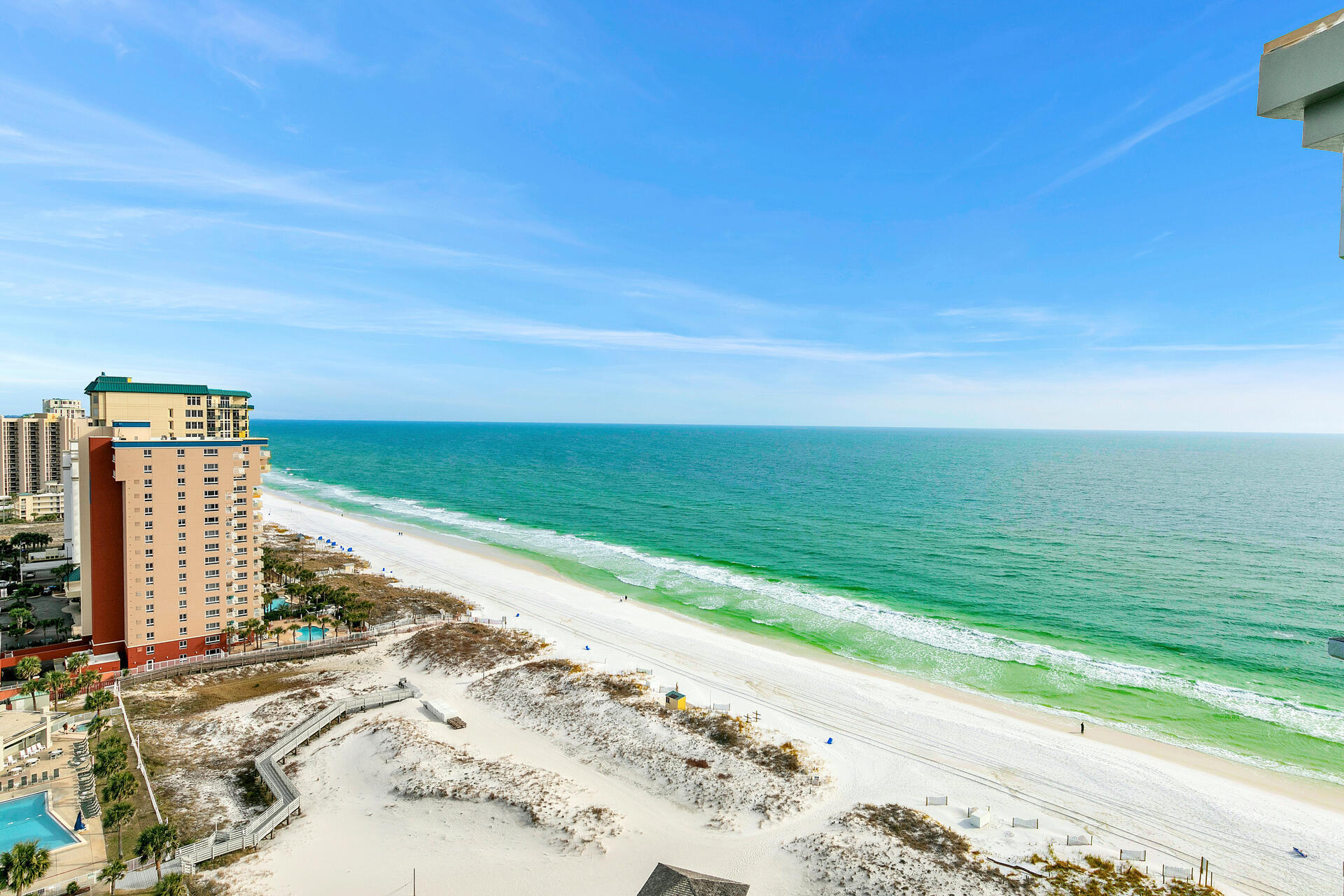 Pelican Beach Resort Condo #2015 is the ultimate beach vacation property and is a RENTAL MACHINE.  With a coastal inspired theme, it has 2 bedrooms, 2 baths which gives it plenty of space to comfortably sleep 6. It's an ideal rental property.  Why? It's perfect for families, for friend trips or for romantic escapes so you capture everyone. You and your guests can enjoy al fresco meals and coffee on the huge balcony while taking in the Gulf breeze and amazing coastline views. Let's talk about what you get in this condo:
  
- Tile throughout with upgraded tile in the bedrooms.
- Gulf front Master Bedroom with King bed
- Private Master Bathroom with shower tub combination
- Guest Bathroom with a walk-in shower.
- Both the front and guest bathrooms boast upgraded cabinets with quartz countertops.
- 2nd bedroom with custom built bunk system featuring a queen size bed on the bottom with a twin bed on top and another in the trundle under the queen.  This is perfect for older kids and adults. 
- Beautiful and comfortable living room furniture 
- Large SMART tv
- Fully equipped kitchen with stainless steel appliances and stone counters
- Large Dining area seats 6 with Gulf views
- Washer/Dryer in the condo!

Let's talk about lifestyle. You and your guests can relax on the balcony, take in the impressive views, challenge your family to a game of tennis on the two tennis court, slide down the tubes at the Big Kahuna Water Park directly across the street, sip on a tropical cocktail from the poolside Tiki Hut, rent a kayak or chair/umbrella set up from beach side service, or enjoy the dining, shopping, spas, golf and all the entertainment the Emerald Coast has to offer. This condo is located in a PRIME spot in Destin that is close to everything!

Let's talk about the amenities you and your guests are going to have access to:
- 3 Large swimming pools and 2 sun decks, indoor/outdoor swim-through pool, kiddie pool, and spa
- New zero entry beachfront pool with 14 person spa!
- Tiki Hut with tropical beverages and frozen drinks  service right to your beach chair! (seasonally)
- Market Café/Deli & sundry shop
- Outdoor grilling area
- Conference/event center for weddings/meetings
- 2 Tennis Courts 
- Fitness Center with steam room and sauna
- Arcade

As you can see Pelican Beach Resort Condo #2015 is the perfect option for a vacation rental investment or a second home to use at your pleasure.