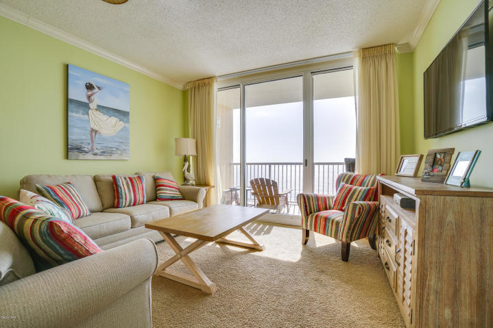TERRIFIC MID STACK LOCATION! This one of a kind property conjures up images of sun-splashed days of swimming, biking, and relaxing. It lives like a beach house but comes with all the benefits of owning a condo. Will convey with luxurious furnishings, window treatments, and artwork that welcome you to lie back, relax, and enjoy panoramic views of the pool, beach and ocean. Condo has 9' ceilings throughout. Open floorplan allows for fabulous Gulf and sunset views from balcony, living room, dining room, kitchen, & master suite providing the ultimate alfresco living and entertaining environment The fully equipped kitchen features upgrades such as soli granite kitchen countertops, stainless steel appliances, upgraded sink, and custom mirrored backsplash.