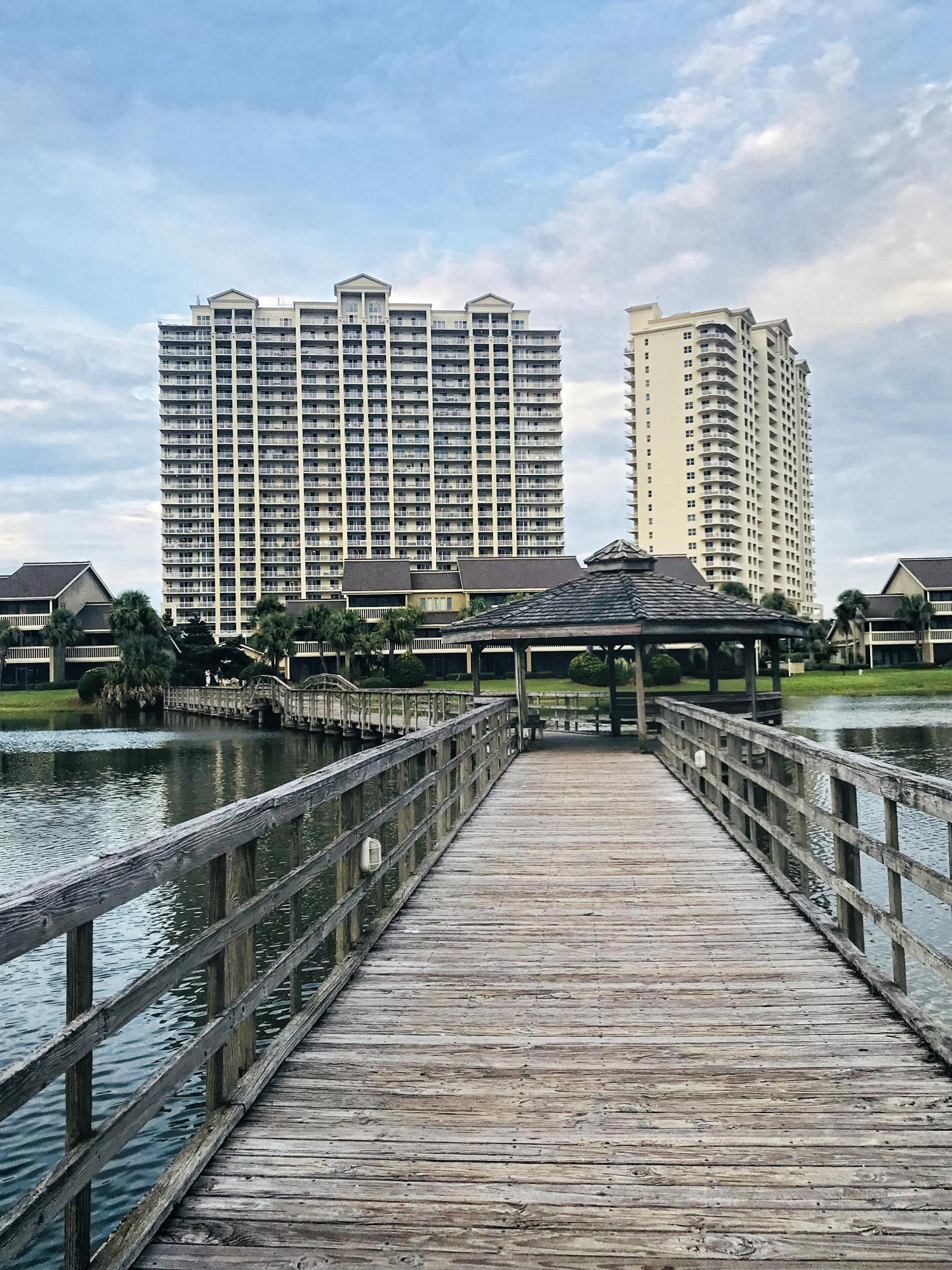 As you walk into this spacious 1763 sq ft 3 bedroom 3 bath condo you will instantly understand the rental income potential. Estimated rentals of $35,000 to $40,000 annularly. The open concept kitchen and generous size living room opens onto a balcony that is almost 400 sq ft. It feels like it's own room with views of the Gulf, two pools and Stewart Lake. The entertaining possibilities are endless on a balcony that size. The lg master suite features double vanities, separate walk in shower and garden tub as well as walk in closet. Guest bedrooms feature their own en suite baths and one perk is a balcony with golf course views. Seascape Resort has 2000 ft of deeded beaches, a 18 hole golf course, heated pools, tennis, bike rentals, basketball, wave runner, kayak,paddle board and water bounce toy rentals.   Beach tram, beachrestaurant and bar that are open daily.  All new SEASCAPE TOWN CENTER. There is something for everyone. The Cabana Cafe in Ariel Dunes is also open daily with a full service bar and features local music seasonally. Seascape is a gated  community - over size rental space for your boats waver runners, RVs etc.Kitchen renovation are complete and it looks magnificent..