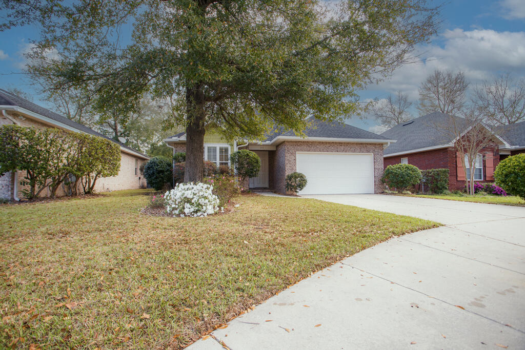 Wanting a short commute to Eglin AFB???Conveniently located within minutes to  base for anyone prioritizing a short drive. Beautifully maintained 3 bedroom home  built by the well known Huff Builders.   This subdivision  features sidewalks and streetlights for those late night strolls. The home features a new HVAC system in 2024, LVP flooring throughout the main living area, a warm and inviting gas fireplace surrounded by built in cabinets . The layout is both functional and comfortable,  Dining Room, kitchen and living room are open to each other and features 10' ceilings and 8'doors.  The added enclosed back patio is vented for air and heat making this a great place for morning coffee.  Granite countertops, newer gas stove and dishwasher with refrigerator and breakfast bar complete the kitchen.  New shower and tub in Jack n Jill guest bathroom.  Separate audio/video closet.New garage door opener and key pad. Sprinkler system throughout yard...no need dragging the hose around.  Privacy fenced backyard with a large shed for all your gardening tools.  Interior of home has been completely painted .  Transferrable termite bond  with Bryan Pest.  No HOA  fees!!!  Don't miss your opportunity to make this lovely house your home!!!