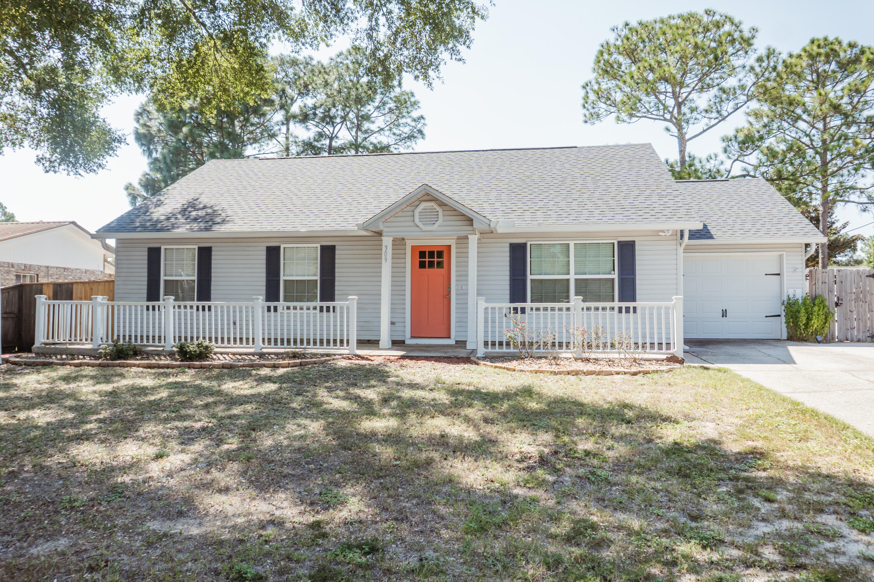 Available now with price reduction...Immaculate and beautiful 4-bedroom 2 bath located in South Crestview. Recently renovated kitchen has nice white cabinets, granite, kitchen island, and built in bench in the eat in kitchen area with ship lap accents.  Stainless appliance package with natural gas stove.  Newer paint features natural and neutral tones in the home.  The white cabinets and granite counters are carried through to the bathrooms.  Tile flooring in the home, open back deck, spacious back yard with privacy fence.  No inside smoking or vaping.  Pets allowed with owner approval and pet fee.  Oversized driveway and yard building.  South Crestview convenience with easy access to bases, beaches and shopping.