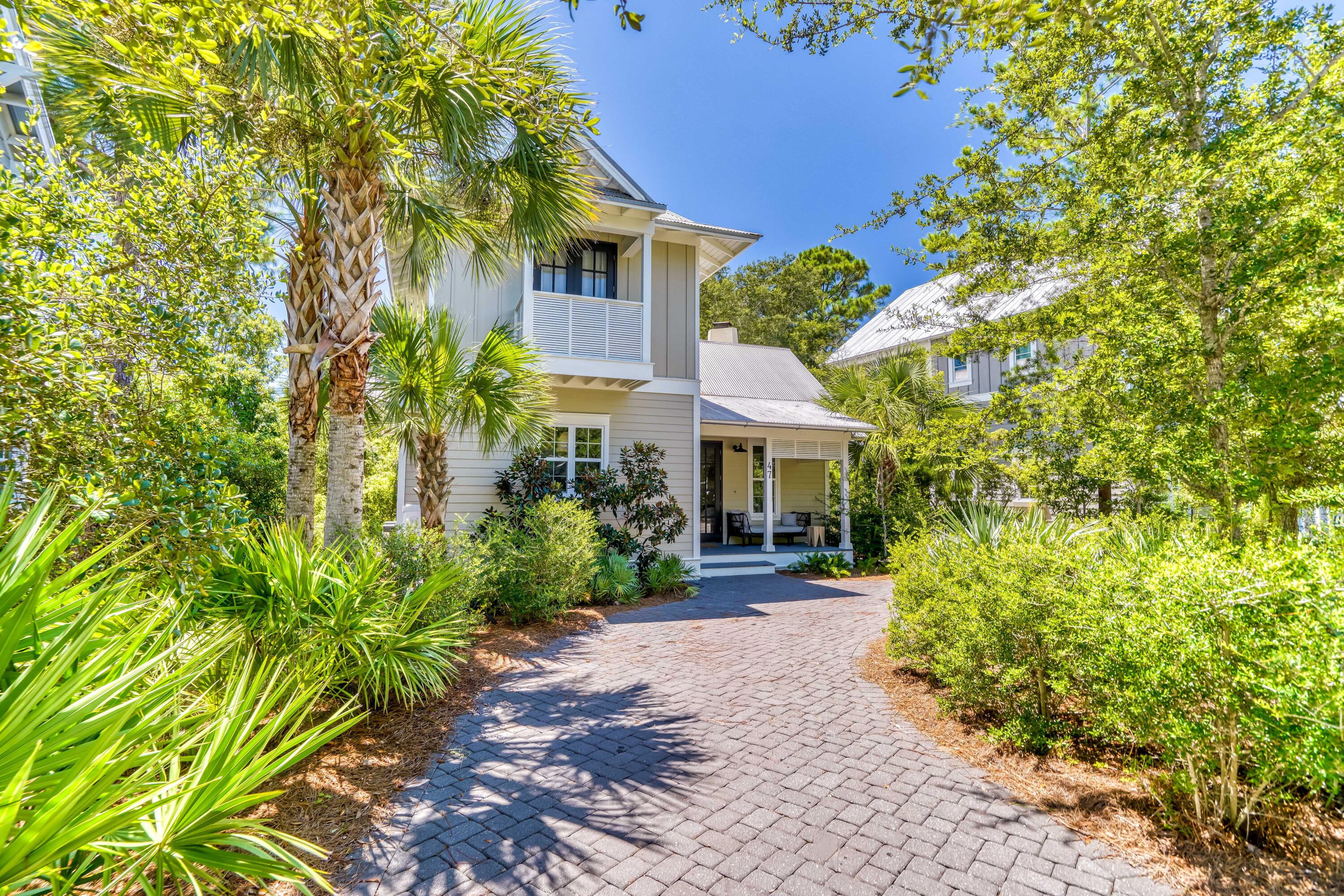 Tucked inside the exclusive gated community of The Hammocks, 47 Hammock Lane is your serene retreat just moments from the Gulf, nestled between WaterColor and Seagrove Beach. This 3-bedroom, 4-bath home combines timeless craftsmanship with a coastal ease that's perfect for both everyday living and beachside getaways.

Step inside to find wide-plank reclaimed hardwood floors, soaring vaulted ceilings, and an open-concept layout designed for gathering. The chef's kitchen features premium stainless steel appliances and overlooks the living space anchored by a gas fireplace. Each bedroom is generously sized with ensuite baths, offering comfort and privacy for family and guests alike.

A sun-drenched Florida room—surrounded by windows and finished with slate floors—adds flexible living space that can serve as a guest suite, office, or additional lounge. Outdoor spaces provide privacy and room to relax, and the location offers convenient access to nearby dining, shopping, and beach access points along 30A.

The Hammocks offers two neighborhood pools and a peaceful boardwalk leading to Western Lakeideal for launching a paddleboard or kayak. Whether you're looking for a primary residence, a second home, or a standout rental opportunity, this home is a rare chance to own in one of 30A's most desirable pockets.