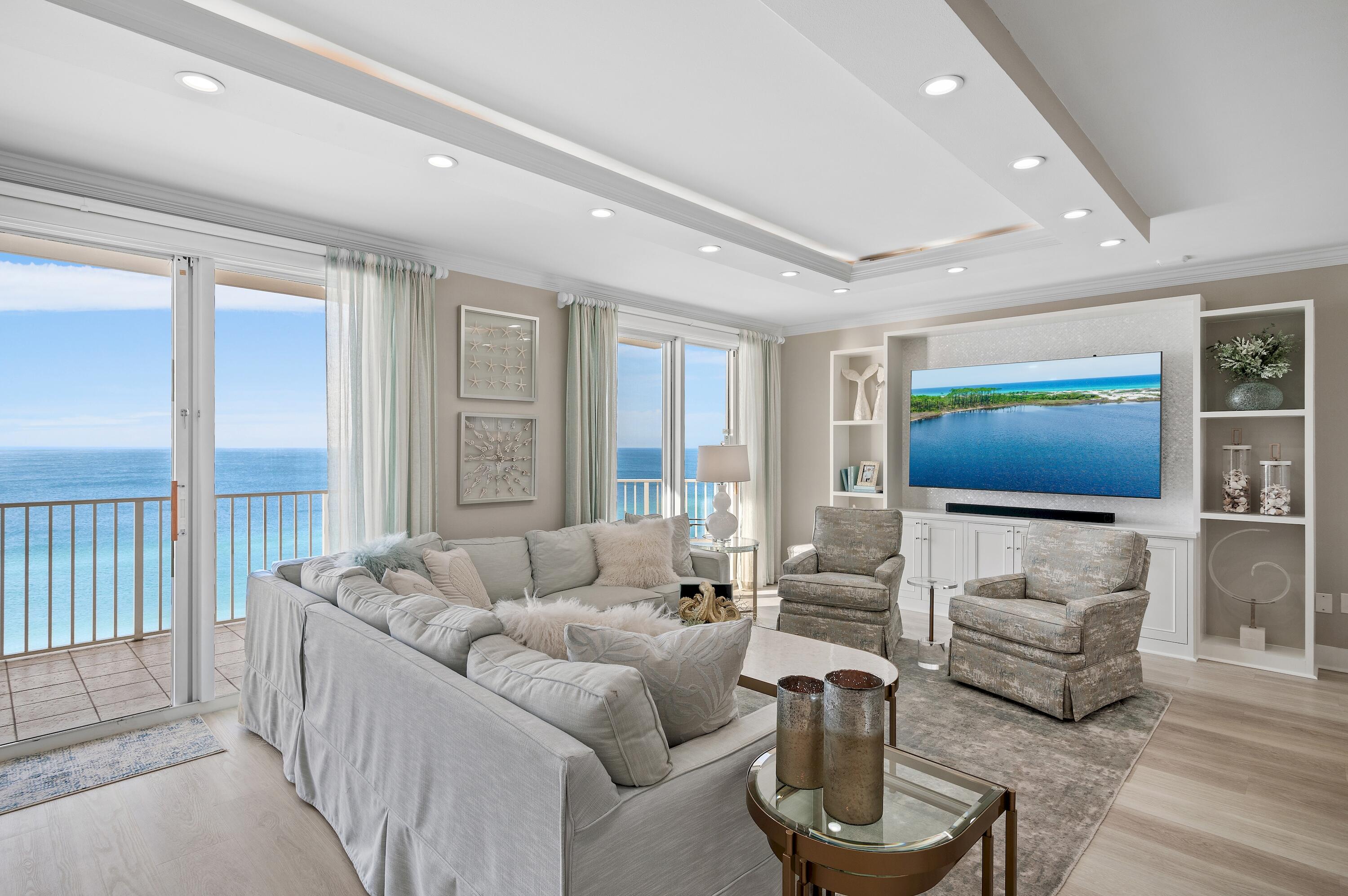 This exquisite, completely renovated penthouse at Majestic Sun will absolutely take your breath away. Situated on the 12th floor, the expansive Gulf views are simply stunning. Offering 3 bedrooms and 3 baths spread through a spacious 2,212 square feet, the unit went through a quarter million dollar renovation in 2021/2022 designed and furnished by the renowned Risa's Interiors. It's expansive upgrades include quartz countertops throughout, new flooring throughout, remodeled kitchen with new cabinets, island and all new LG appliances, custom entertainment center, all new lighting fixtures, new HVAC system, electronic shades in the den, custom draperies in master with custom plantation shutters in guest bedrooms, fresh paint with new trim and baseboards, custom closets, new televisions, and all new furnishings and artwork which will remain. In addition to the 3 bedrooms, the unit includes four built-in bunk beds with new shiplap siding. This unit also comes with a highly coveted assigned parking space in the underground garage. Majestic Sun offers owners and guests an indoor (heated) and outdoor pool, two whirlpool jacuzzis, and fitness center. Located behind the guarded gates of the Seascape Resort, which offers 2000 feet of pristine white sand beaches and 300 acres of lakes, golf, pools, and tennis. The Seascape Town Centre is offered onsite as well and features great restaurants such as Acme Oyster House and Mezcal Mexican Grill, as well as the Thrills Lazer Tag and Arcade! Come take a look at this incredible luxury unit. Buyer to please verify all information contained herein.