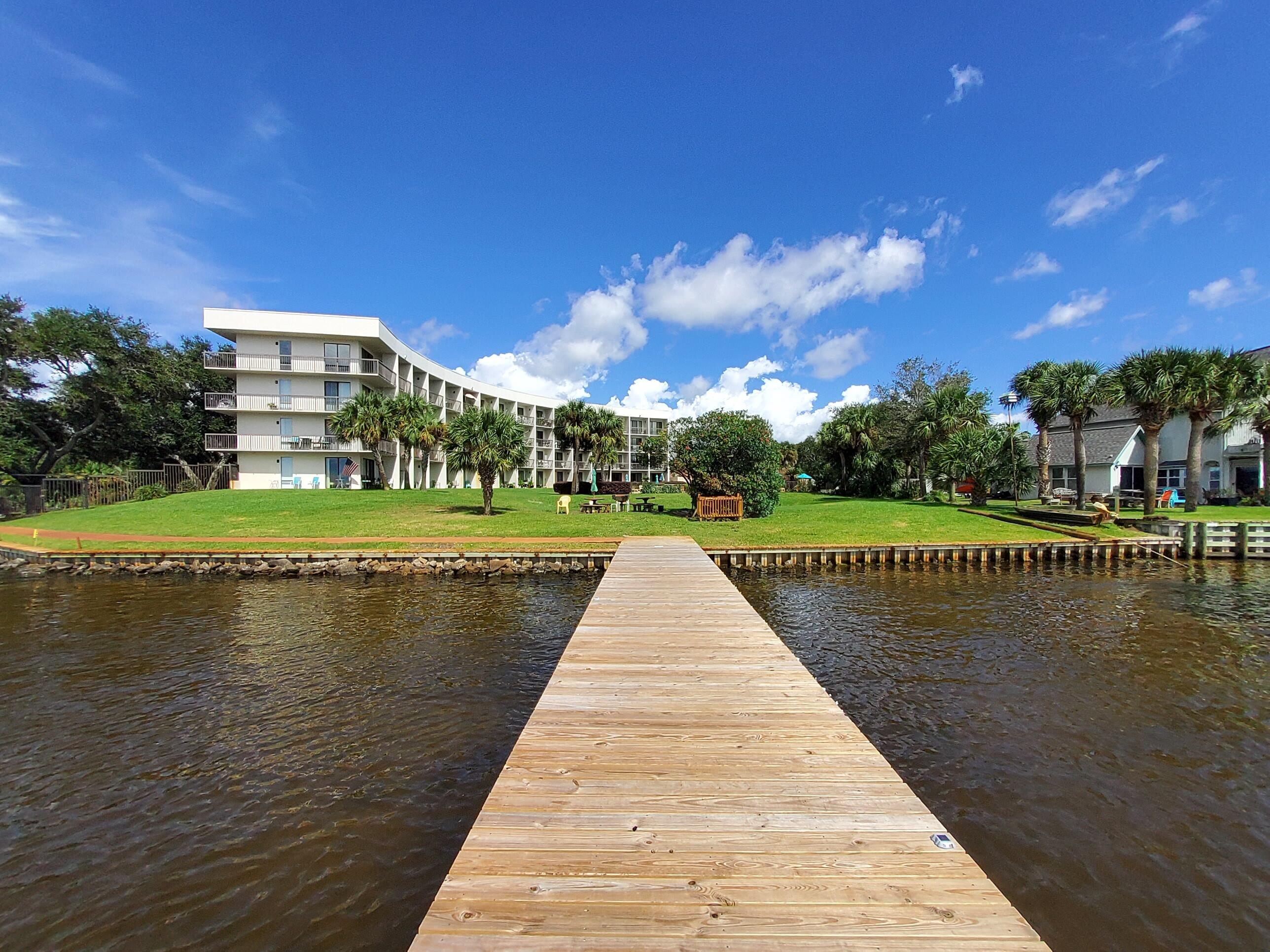 Sound Front Fully Furnished Renovated Studio Condo conveniently located on First Floor of Pirates Bay. 36' Boat Slip E-01 conveys,  Marina undergoing a Million dollar renovation slated for completion by Memorial Day 2022.- special assessment already paid.  Sliding glass doors lead to a covered patio and a Beautiful swimming pool.  Find a barbeque area just beyond pool at Waters Edge.  Docks for the Marina located right on the Sound.  This unit features a Murphy Bed with plenty of room for the couch and kitchen table. The functional kitchen has full size fridge, custom cabinetry, microwave, Air Fryer oven, sink and a stackable washer and dryer.  Tasteful decor and an abundance of natural light make this unit a great investment, second home or week-end getaway.  Dock and Condo offered As-Is,