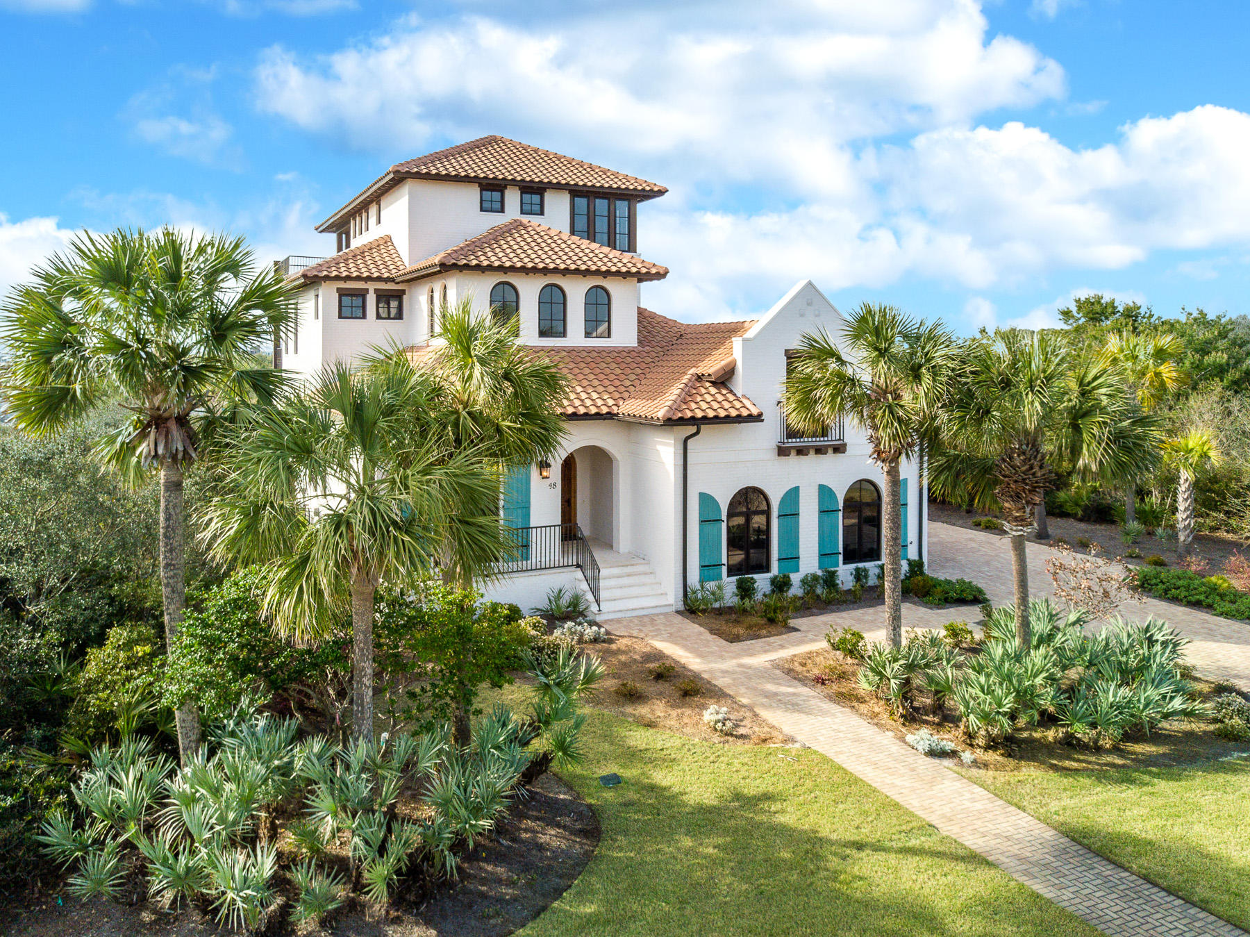 Beautiful Mediterranean style home in the private gated neighborhood of Paradise by the Sea. This home was custom built in 2015 and has all the upgrades today's buyers wish for. The large master suite as well as the main living area are found on the ground level. The open concept kitchen/living/dining area opens to a backyard oasis through a wall of glass sliders. A summer kitchen and large outdoor dining area lead to home's luxurious and unique private heated pool and spa. The home sits on just over a 1/4 acre lot and is full of beautiful tropical landscaping. Paradise By the Sea is home to some of the most private stretches of beach on 30A, nestled between Rosemary and Alys Beach and in walking distance to all the shopping and dining of Rosemary, Seacrest, and Alys. The home features a 3 car garage with plenty of storage, elevator, fireplace, media room, central vac, and deeded beach access. It is being sold fully furnished, including a Young Chang baby grand piano, and 6 person golf cart.