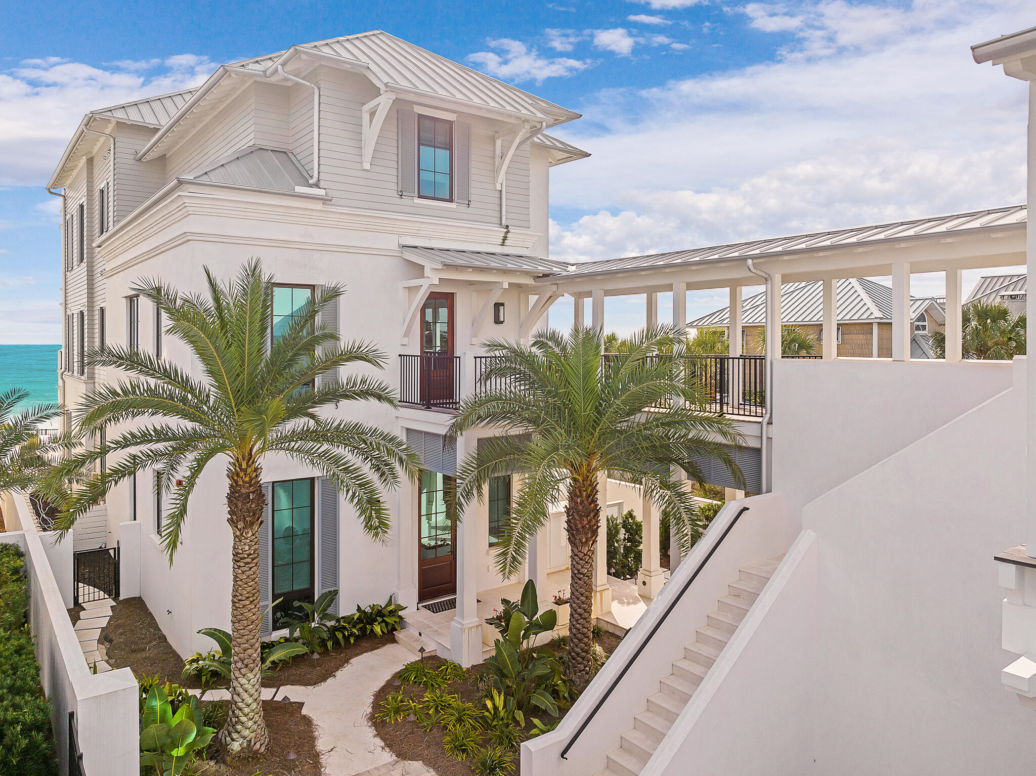 Presenting an unparalleled coastal haven on the East end of 30A, this extraordinary concrete construction, expertly rendered by A BOHEME Design, stands as an architectural masterpiece and true legacy retreat. Primely positioned, it's among the closest available beachfront properties to the cherished locales of Rosemary Beach, Kaiya, and Alys Beach, offering the epitome of luxury living with exceptional new urbanism proximity. Privately gated, this regal residence is compound in nature, offering an attached carriage house over the expansive three-car garage that has room for up to six cars with a commercial lift. The adjoining carriage house is complete with a full kitchen, expansive living quarters with gulf views, a refined dining area, and a versatile bunk rooman exclusive retreat within an already unparalleled setting.

Elevated over 35 feet above sea level, this sanctuary offers ample tranquility and safety amidst the coastline's allure. A resort-style, private Gulf-front pool and 54 feet of pristine shoreline provide a captivating backdrop, inviting moments of relaxation and revelry.

Spanning 7,650 square feet heated and cooled, this residence showcases meticulous craftsmanship across its impressive four-story vertical footprint, providing easy access via a private elevator. The first-floor layout seamlessly integrates the kitchen, living, and dining spaces, embodying a harmonious blend of functionality and sophistication, ideal for forging cherished memories. The first level also flows freely to the covered rear patio that offers built-in electronic weather screening (phantom screens) as well as a kitchen al fresco with outdoor grill, private pool & surrounding pool deck.

Venture further, and the second floor unveils an exquisite library and an inviting sitting room/living space, exuding an aura of refined comfort and cultivated elegance. Two Gulf-front suites, alongside another suite, grace this level, each offering mesmerizing views of the emerald green waters.

Ascend to the third floor, where two additional Gulf-front suites preside over the beautiful south elevation, continuing the narrative of luxury and comfort with panoramic vistas that captivate the soul. The rooftop level has a viewing deck that spans a full 180 degrees offering views from Destin to Panama City up and down 30A.

Ensuring accessibility throughout, a private elevator gracefully connects the levels, enhancing the ease of movement within this meticulously designed haven.

This residence, meticulously built by Velvet Sun in 2020, epitomizes modern amenities entwined with coastal allure, standing as a testament to bespoke craftsmanship and an unrivaled location, offering a quintessential Gulf-front living experience.

This exceptional location provides easy proximity to Alys Beach, Rosemary Beach, Kaiya, as well as the new facilities by St. Joe at Watersound Camp Creek, including the Tom Fazio designed Camp Creek Golf Course and the private FBO & commercial international airport at ECP.

Please reach out to us today for the cost-to-own and rental projection figures for the property.