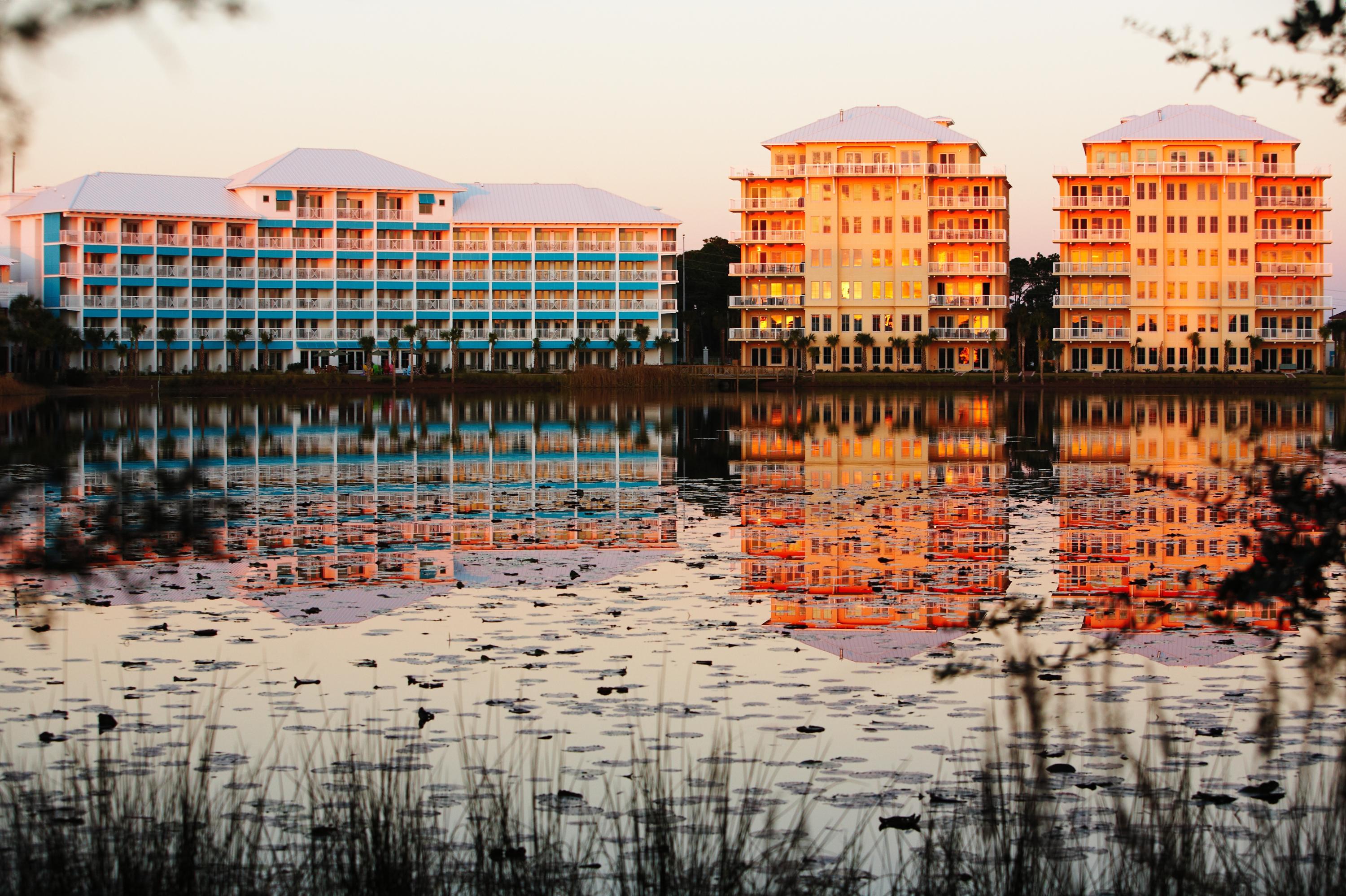 The Sunrise and Sunset luxury condominiums look over the shores of Lake Carillon and the Gulf of Mexico. This spacious 1st floor unit has upgraded finishes, appliances and innovative floor plan. It is the perfect answer to your quest for a private vacation space, a rental property or a full time residence. These condos are only minutes from the NW Florida Beaches International Airport, Pier Park and Frank Brown Aquatic Center. The covered porches afford maximum relaxation and entertaining possibilities. As an integral part of Carillon Beach, the condos have access to all amenities including almost a mile of dazzling sugar sands beaches, four pools, tennis courts, basketball court, and playgrounds.