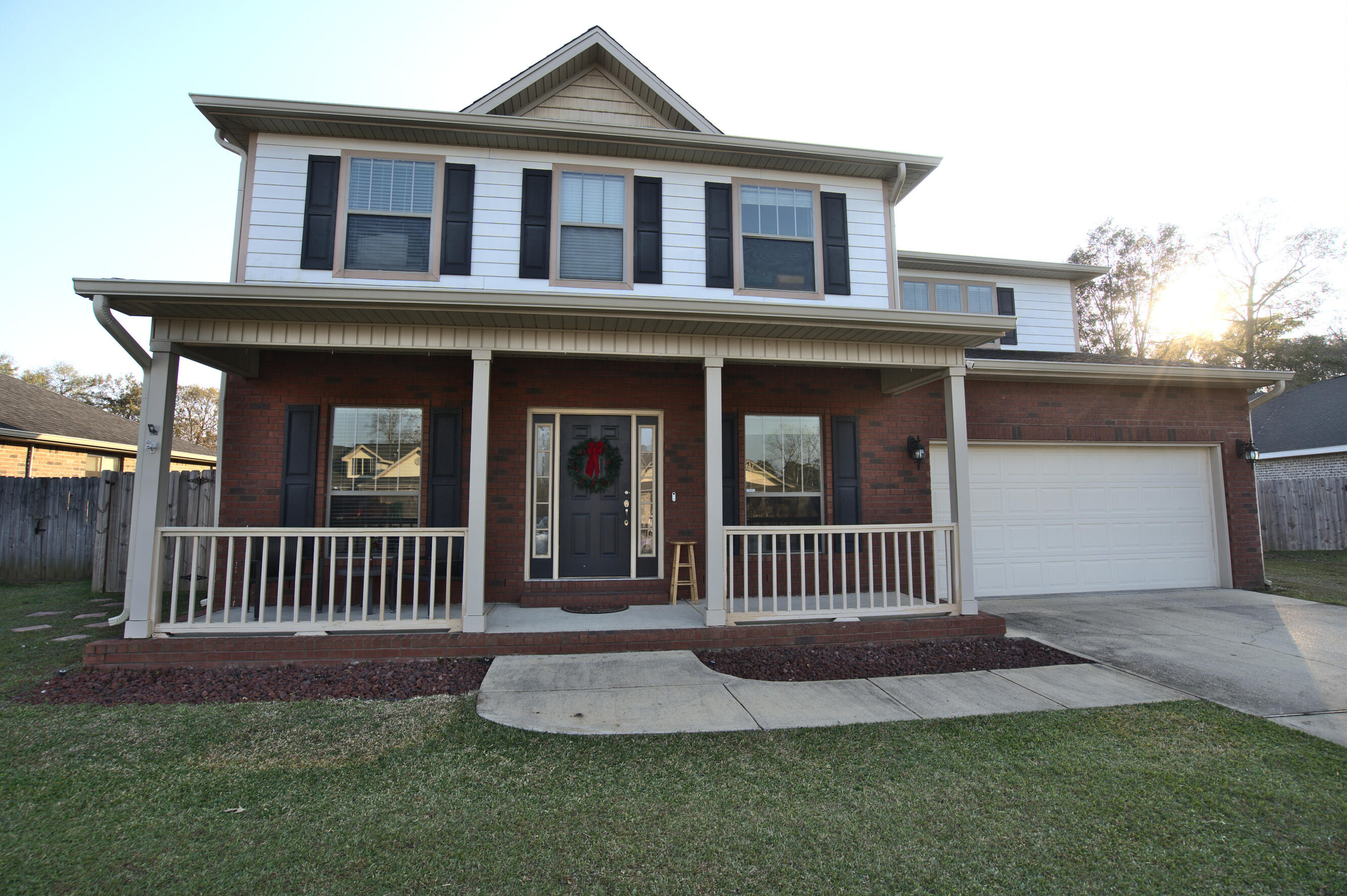 This spacious two-story home offers comfort, convenience, and a host of amenities:  Perfect for those who love extra bedrooms, a family room and more. Fenced Backyard with 2 gated entries makes it ideal for privacy and outdoor activities. Enjoy a luxurious large shower in the Master Bath. A bedroom with its own bath is located downstairs. New flooring in main areas. Laundry area is conveniently located upstairs. The Kitchen is equipped with stainless steel appliances to include double ovens. Walking distance to pool & tennis courts. Situated in North Crestview: drive to Publix, the library, post office, Middle & High schools in 5 minutes! Approx 6 mi to I-10. Pets welcome with owner's approval. Available now!  Schedule your viewing today!