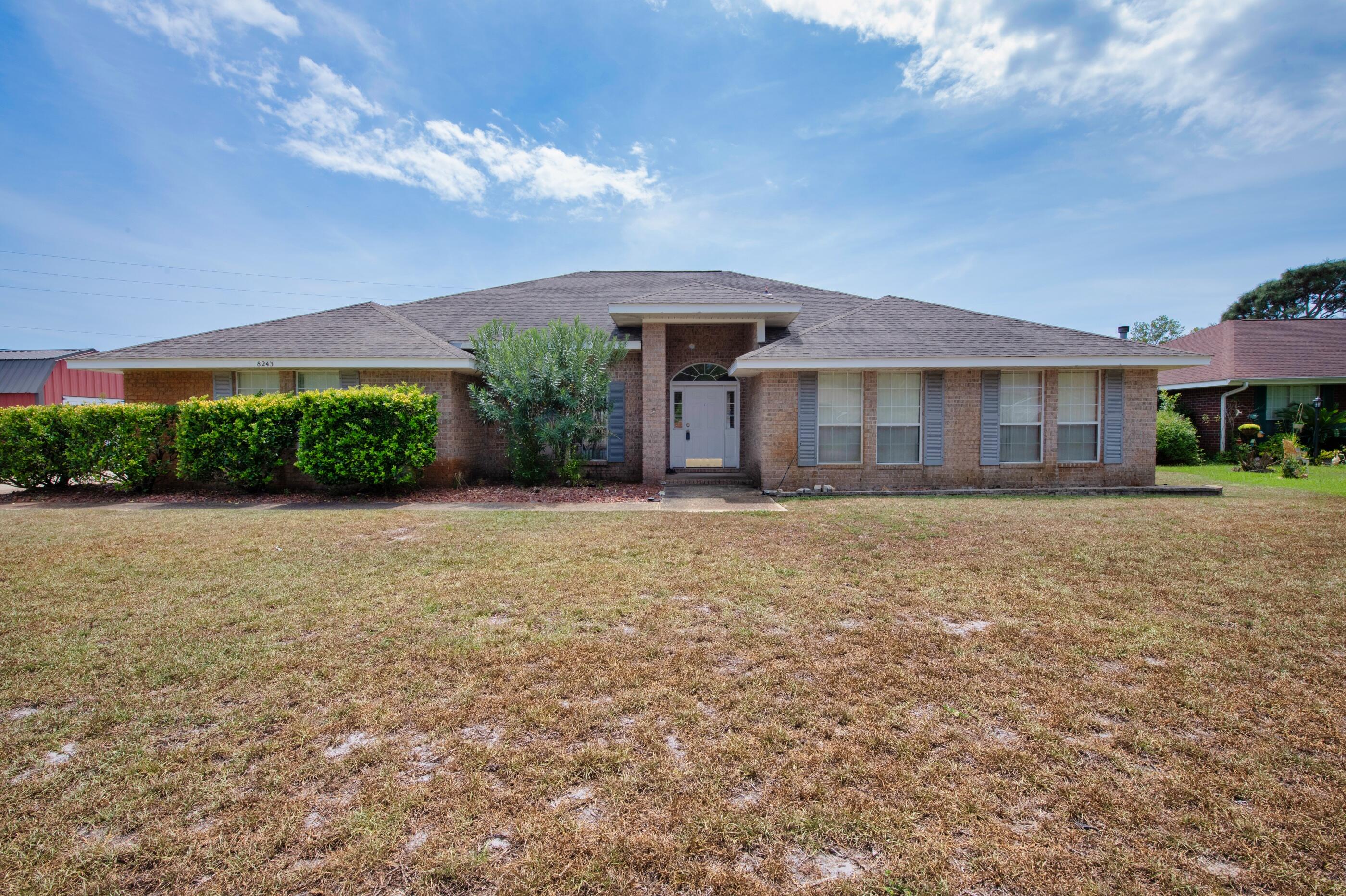 Spacious, 4 Bed/3 Bath brick home conveniently located in Hampton Ridge Estates with no HOA.  Open and bright floorplan, the great room/dining room area has a vaulted ceiling and a corner fireplace. Large, open kitchen with lots of cabinet space, walk-in pantry, breakfast bar, center island, and additional eating area.  Large Master Suite; the Master Bath has a garden tub, double vanity and a separate shower.  3 additional large bedrooms, 2 with walk-in-closets.  Head outside from the great room to the covered patio, great for grilling and entertaining.  This home sits on a corner lot with a fenced in backyard.  Just minutes from Navarre Beach, Hurlburt Field, shopping, and restaurants.