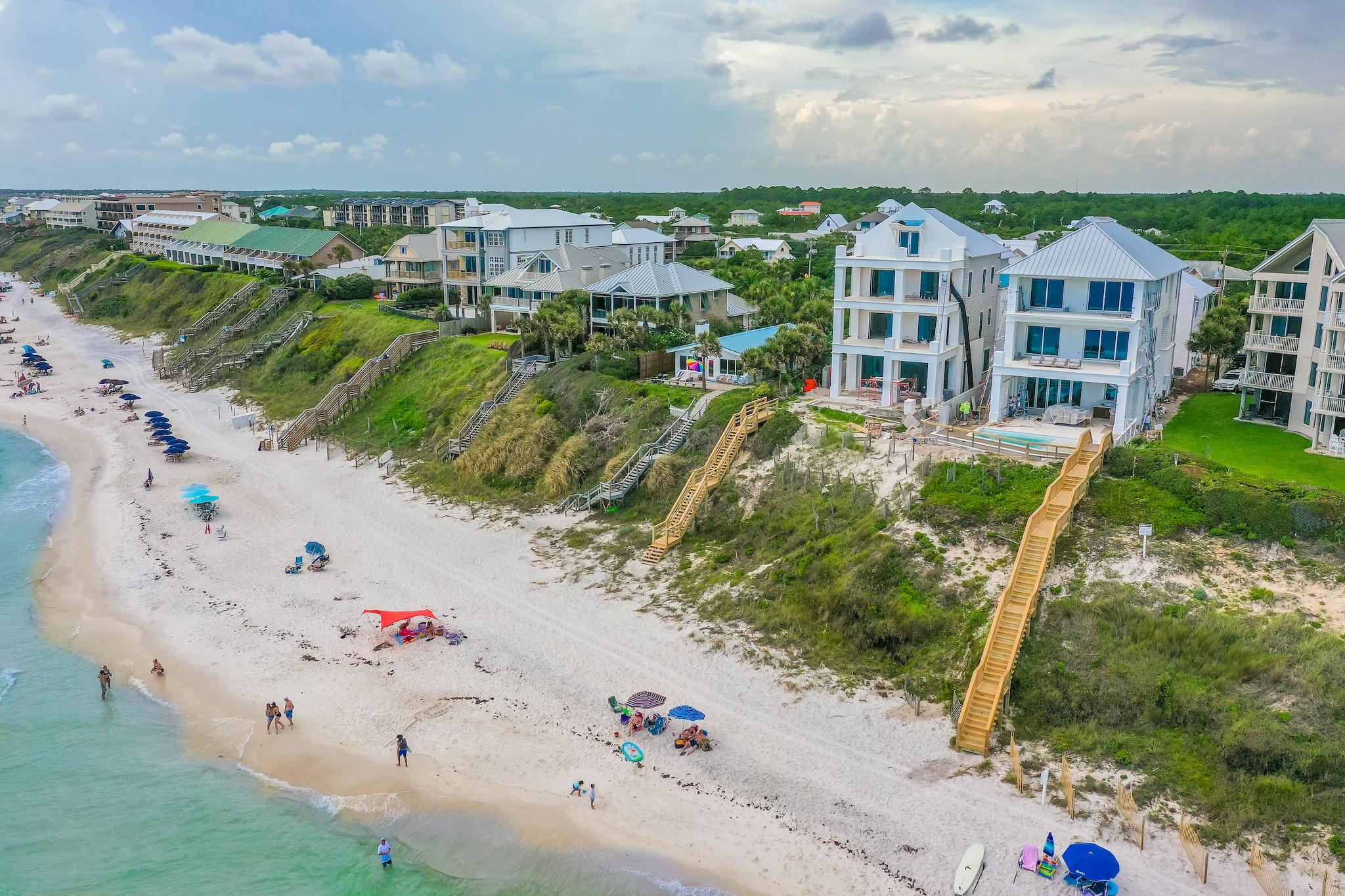 Defining elegance, sophistication and style in a scenic setting with breathtaking sea views, this 7000 square foot home offers 8 bedrooms, 9 baths, a three-car garage, and a spacious carriage house. Admire by day the endless blue horizon stretching as far as the eye can see and marvel at nature's brush strokes painting the sky in shades of red and gold in the evening as the sun slowly sets. A true veritable kaleidoscope of wondrous colour. As stars light up the night sky, the sparkling Gulf-facing pool lights mirror this majestic image, creating a magical atmosphere. Masterful design and stunning architecture are the hallmarks of builder Matt Fuller. The automatic front gate and surrounding perimeter fence complete this Gulf front compound creating a sense of privacy and solitude while still being steps away from all of the world-class dining and entertainment venues 30A has to offer.  An expansive property with appealing aesthetic equilibrium both inside and out, the sweeping Gulf views are incorporated into the design thanks to the expanse of windows and accordion doors. Elegant Venetian plaster walls & ceilings anchored by salvaged wooden beams welcome you into a world of discreet luxury where careful attention to detail is evident throughout. From the exquisite chef's kitchen with oversized island and suite of professional appliances to the beautiful wall of built-ins and private wine closet, every part of this home fills the heart and mind with an extraordinary sense of calm.
 
With oversized guest rooms, each complete with ensuites and access to Gulf-front balconies, the second floor is a warm respite after a day on the water. The walk-over to the carriage house allows for a private escape. Take the elevator to the third floor where a true master retreat awaits, complete with morning kitchen, workout room, his and her bathrooms, a master sitting area, and bedroom all overlooking the stunning Emerald Coast waters.

Notable features of the home include a Gulf-facing heated pool, 2,000+ square feet of balcony space, reclaimed hardwood floors, designer light fixtures throughout, upgraded fixtures, marble tile, private elevator, smart home integration, automatic gated entrance, and professional landscaping.