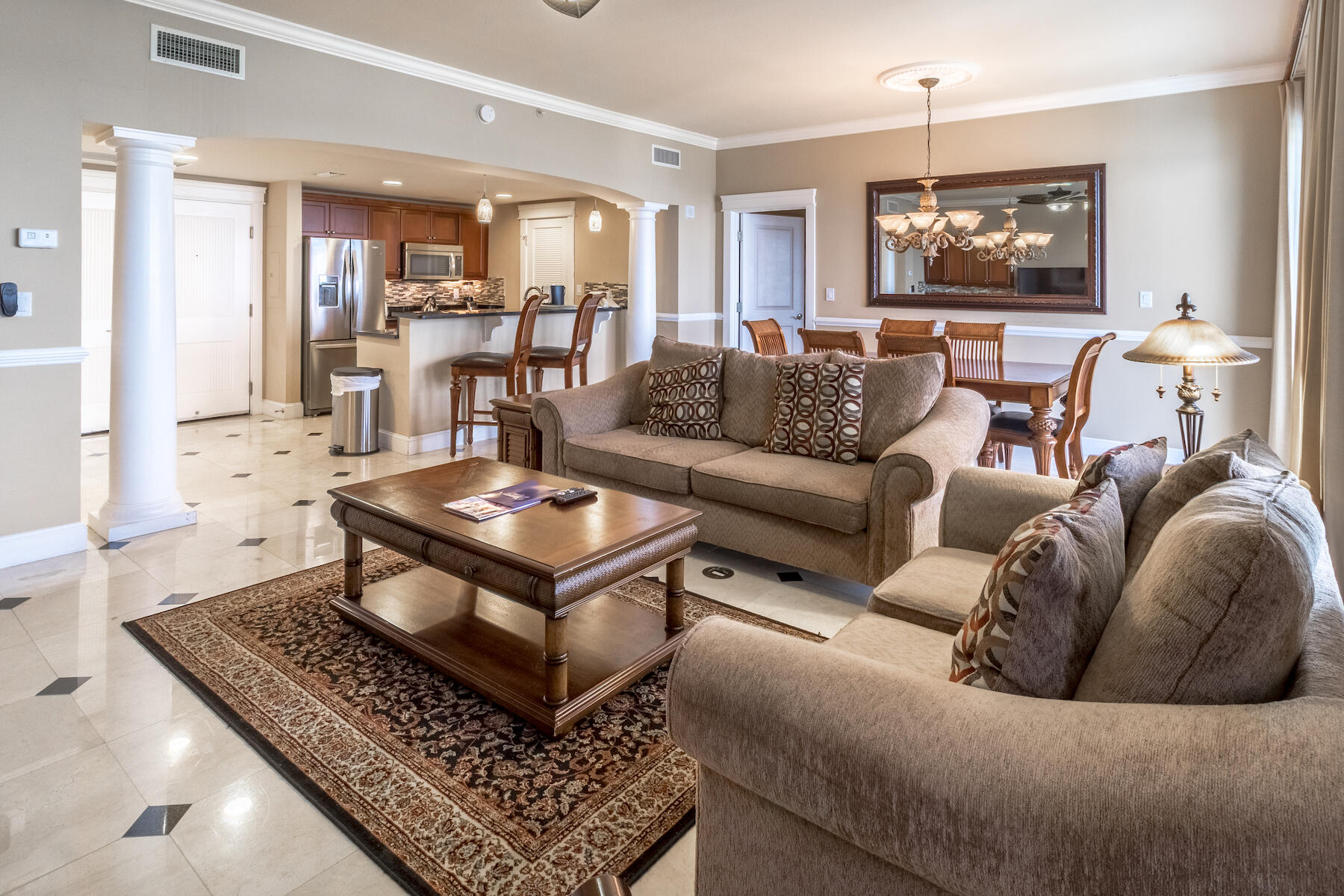 FULLY FURNISHED & ALL UTILITIES INCLUDED AVAILABLE SEPTEMBER 1ST! This incredible 3-bedroom, 3-bath condo boasts just under 1,800 sq ft & offers sweeping views of the Choctawhatchee Bay, Sandestin Marina, and the beautiful grounds of Grand Sandestin from the 9th floor. The balcony faces west which means you'll enjoy breathtaking sunsets over the bay! As soon as you enter this luxurious condo through the solid wood double doors, you immediately notice the amazing bay views as well as notable features such as travertine tile floors with inlay design, elegant columns, Whirlpool stainless steel appliances, mahogany custom cabinetry, granite countertops, and tile backsplash. The spacious open floor concept is ideal for hosting with a wet bar off the living area, room for 6 at the dining table,