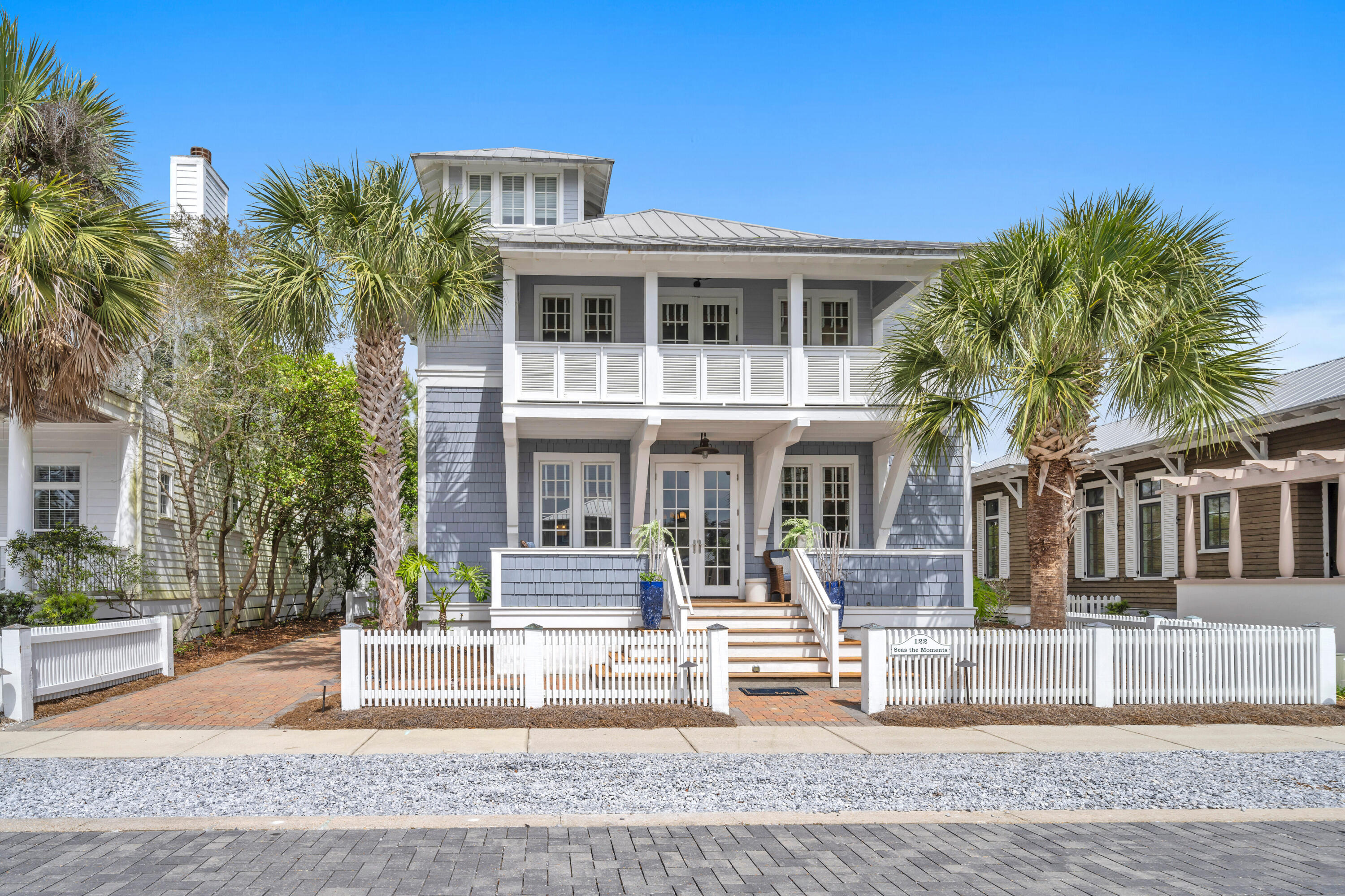 This lovely Nantucket style beach home, situated in the heart of Carillon Beach, is a mere 1-2 minute stroll to the beach walkover and to the year 'round heated community pool, children's play area as well as tennis/pickleball courts.  Featuring 4 BR and 3.5 baths PLUS BUNK ROOM, Seas the Moments offers the perfect setting for a memorable family vacation.  This home, managed by Carillon Beach Rentals, achieved $117,245 in nightly rent revenue for 2024 and has $106,082 booking revenue for 2025 as of 6/18/2025. (Buyer must honor existing bookings through the end of high season). Offered for sale furnished.  Boasting 3900 linear ft. of pristine re-nourished, never-crowded sugary sand beach, Carillon Beach is a quaint, private, strategically situated, secluded and gated community offering 3 community pools, two heated year-round, tennis court, pickle ball courts, children's play area, full court basketball area, meeting house and select shops and dining opportunities. The upscale shopping and restaurants of Rosemary Beach and 30AVENUE are but a 5 minute drive away. Carillon will never experience the heavy traffic associated with certain other high-end areas due to its being gated and buffered on the west by Lake Powell and the state park, allowing you to enjoy proximity to all of the many benefits of 30A with none of the burdens. Unlike several communities to the west, golf carts are permitted in Carillon.  All lot, home, room dimensions are approximates and should be independently verified.
