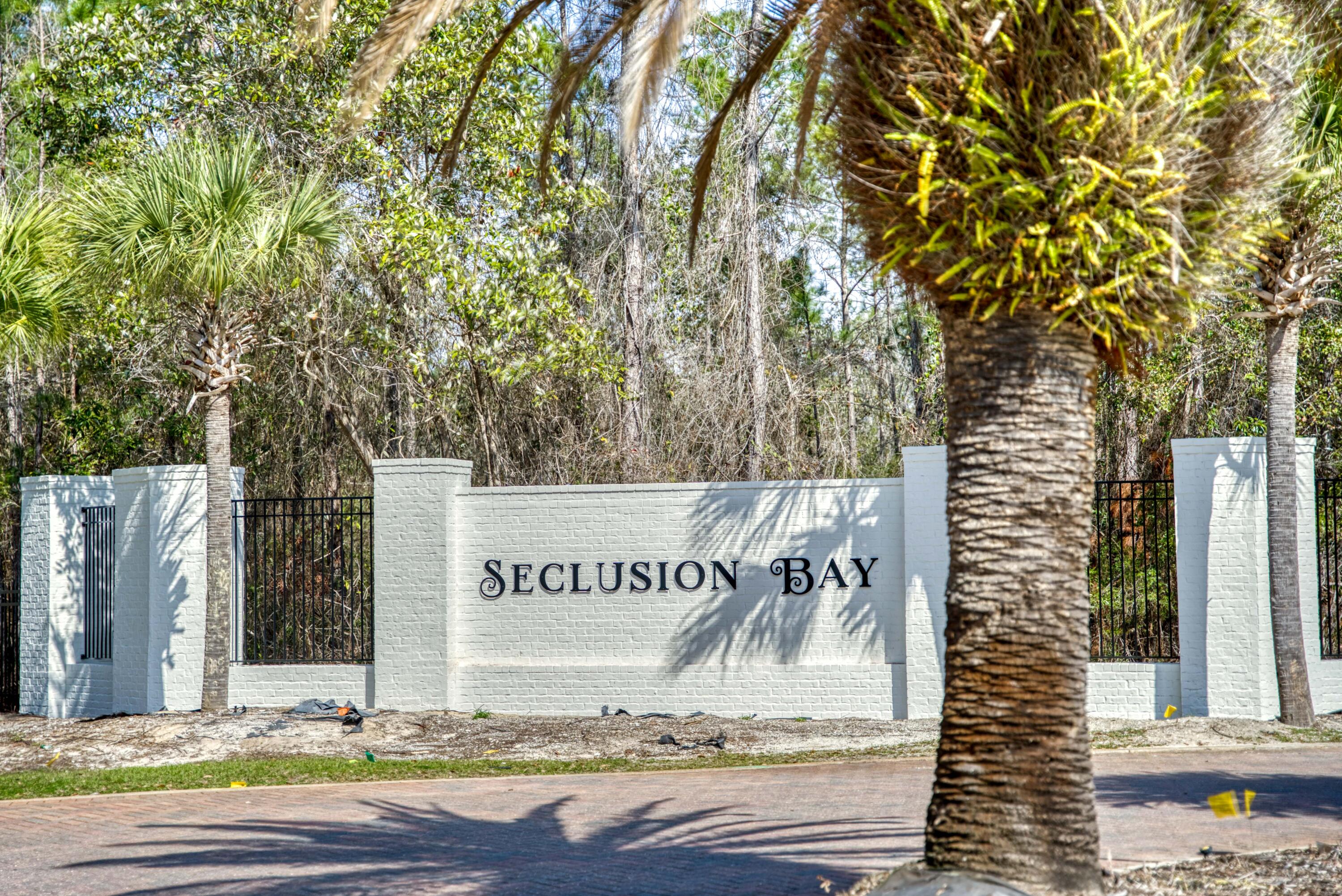 Beautiful 1/2 acre+ homesite in the gated bayfront community of Seclusion Bay that is surrounded by preserve on all sides, which means no homes will be built immediately around it. 

PLUS, plans for nearly 3,300 sq ft home WITH pool convey with the purchase!

Seclusion Bay features some of the largest available lots within a gated community in Santa Rosa Beach, ranging in size from .5acres to 1.5acres. 

All are estate-sized and come with community access to the Choctawhatchee Bay via the neighborhood dock, perfect for paddleboarding, fishing, and a host of other water activities. 

Front entrance is undergoing a stunning renovation to include fresh white brick and updated landscaping. 
This homesite would make a fantastic option for a full-time or 2nd home and the community does... not allow short-term rentals, so your neighbors aren't changing every week. 

Preliminary building plans available to view if desired and there is no buildout time. Call today for more info!